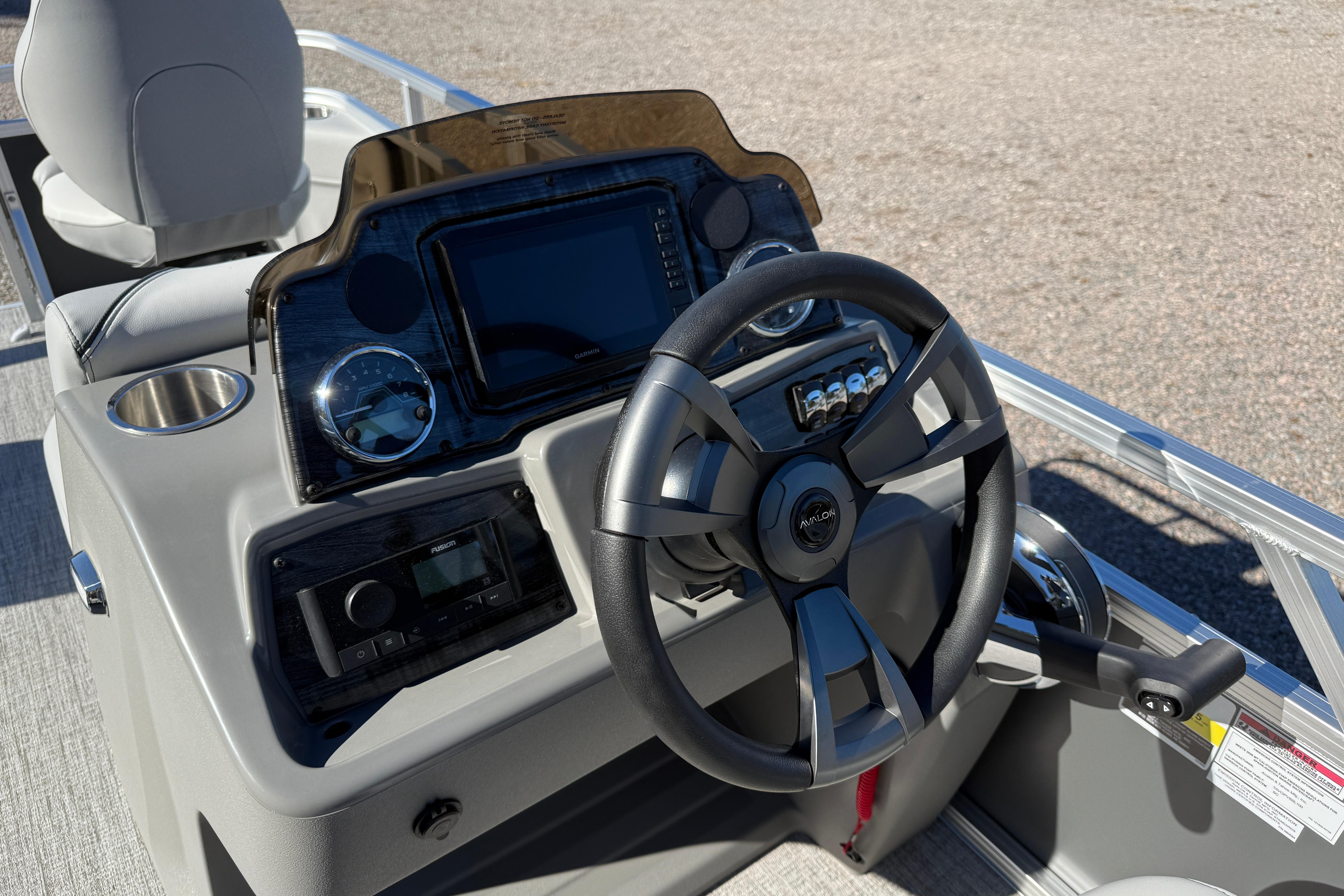 Steering console of 2026 Avalon VENTURE 85 QUAD boat with modern controls.