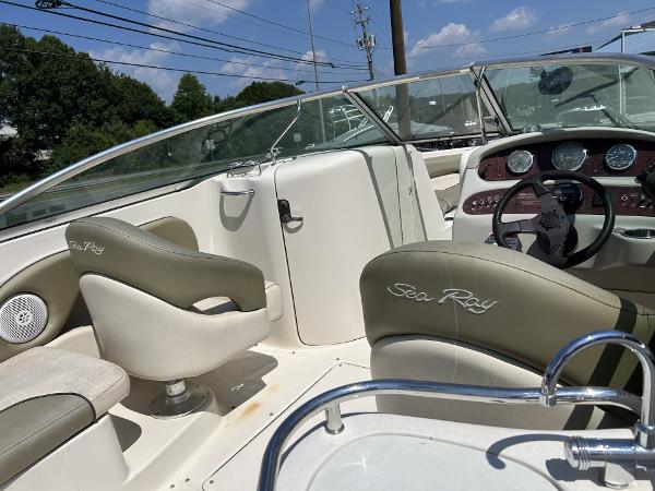 2005 Sea Ray 240 SD boat interior with steering wheel and seating.