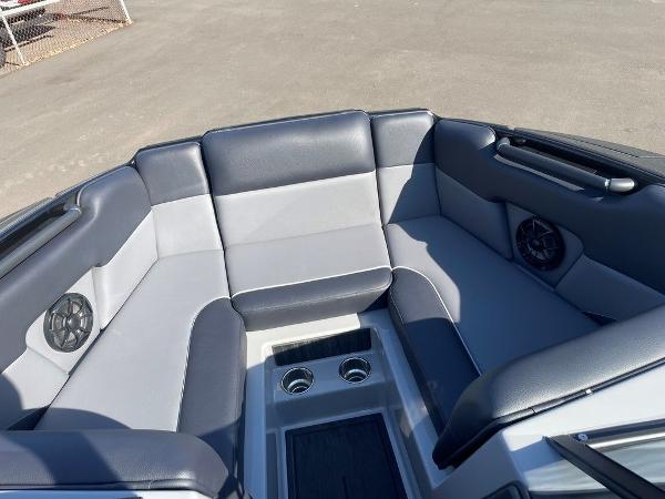 2025 Moomba Mondo boat interior with gray seating and cup holders.