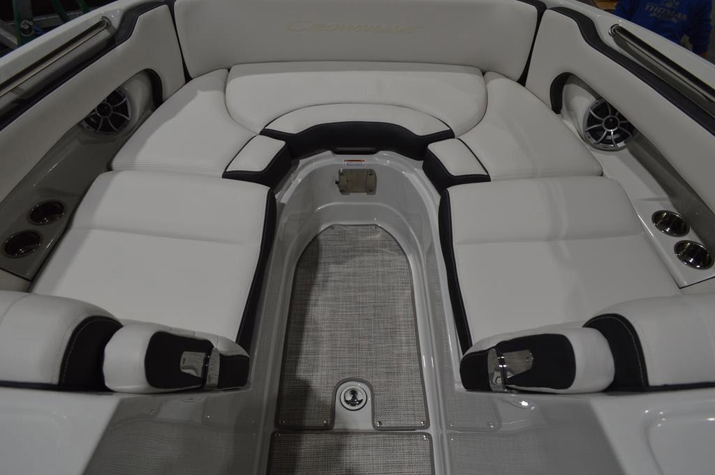 2024 Crownline Eclipse E260 XS boat interior with white seating and cup holders.