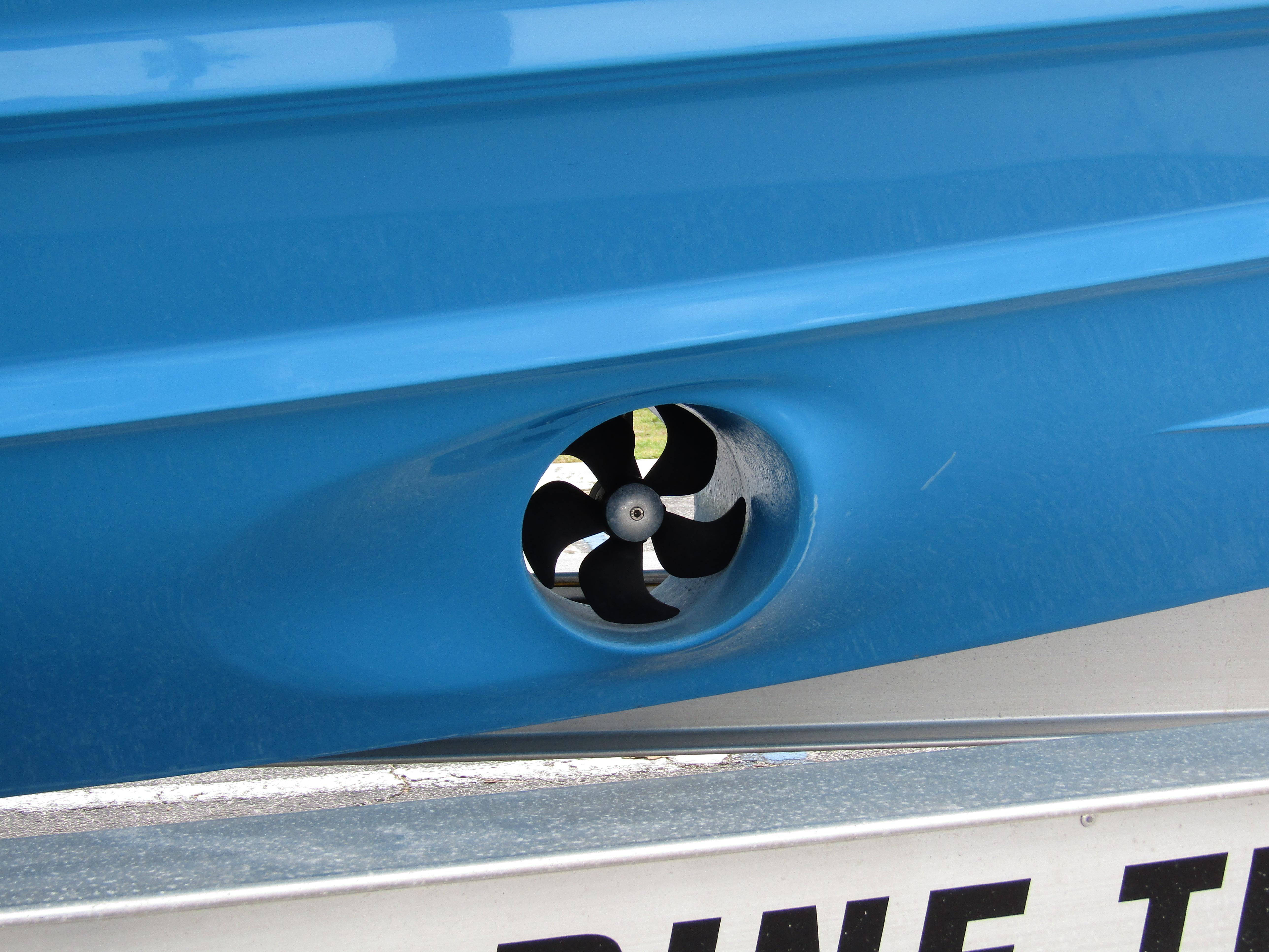 Close-up of a blue 2024 Axopar 37 Sun Top boat thruster.