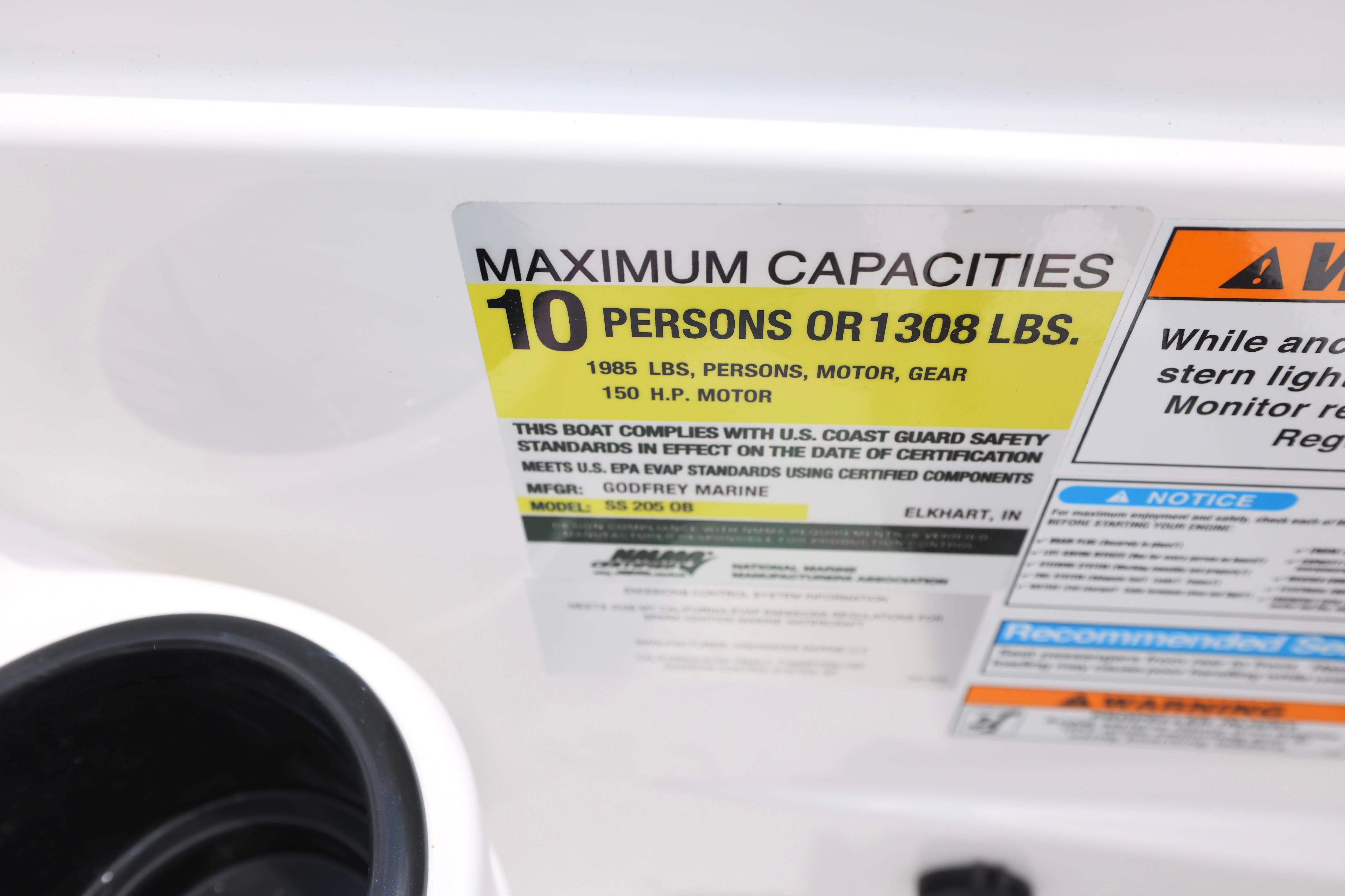 Capacity label on 2026 Hurricane SunDeck Sport 205 OB, max 10 persons or 1308 lbs.