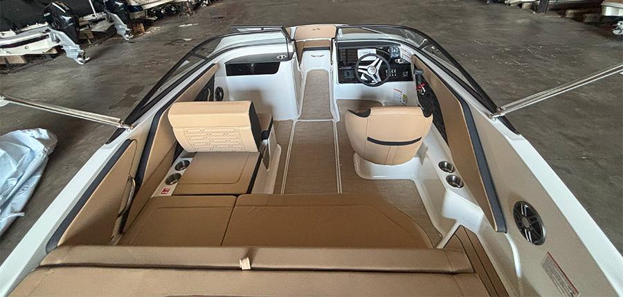 2025 Sea Ray SPX 190 Outboard interior with tan seating and modern dashboard.