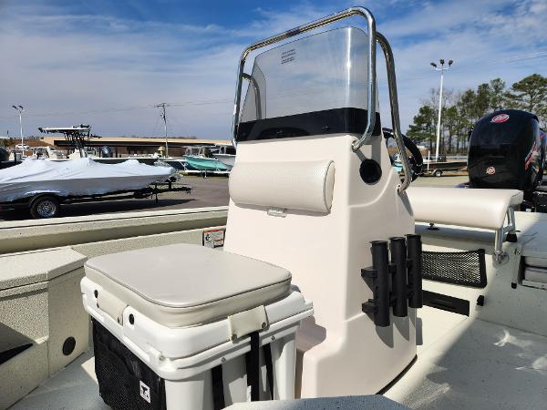 2025 Ranger RB200 boat interior with seating and console, parked outdoors under a clear sky.