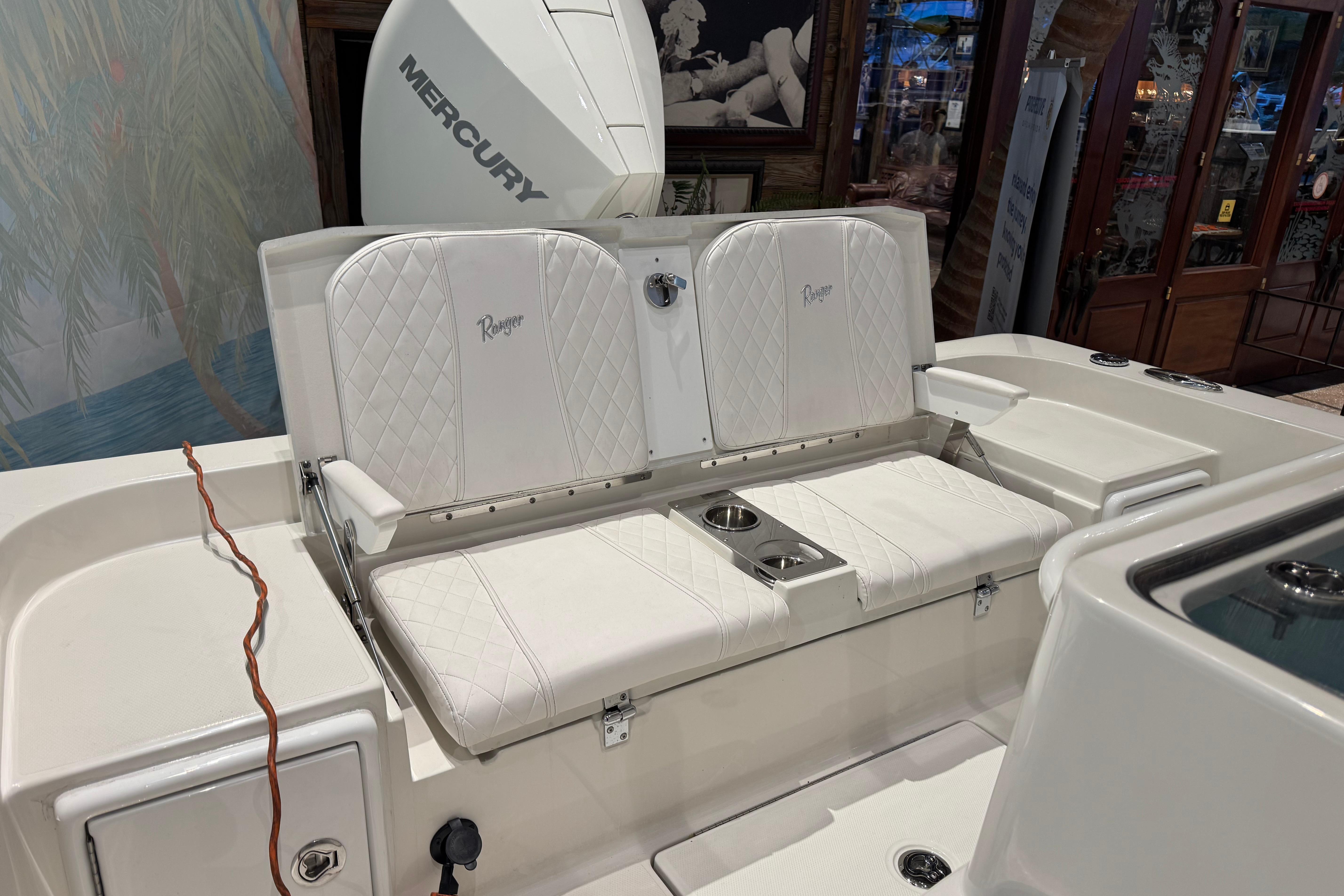 2025 Ranger 2360 Bay boat interior with white seating and Mercury engine.