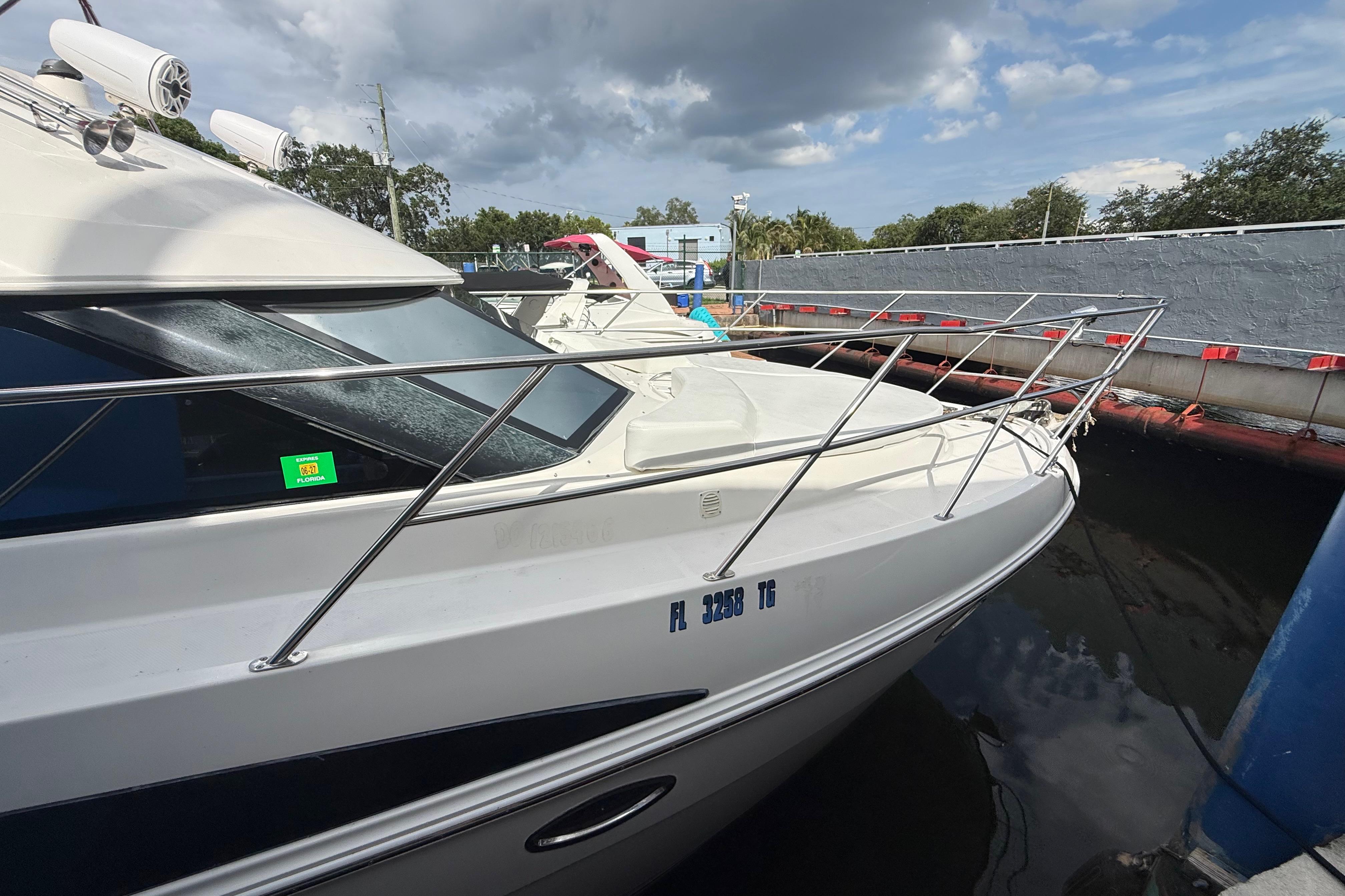 2007 Meridian 459 Motoryacht docked, featuring sleek design and stainless steel railings.