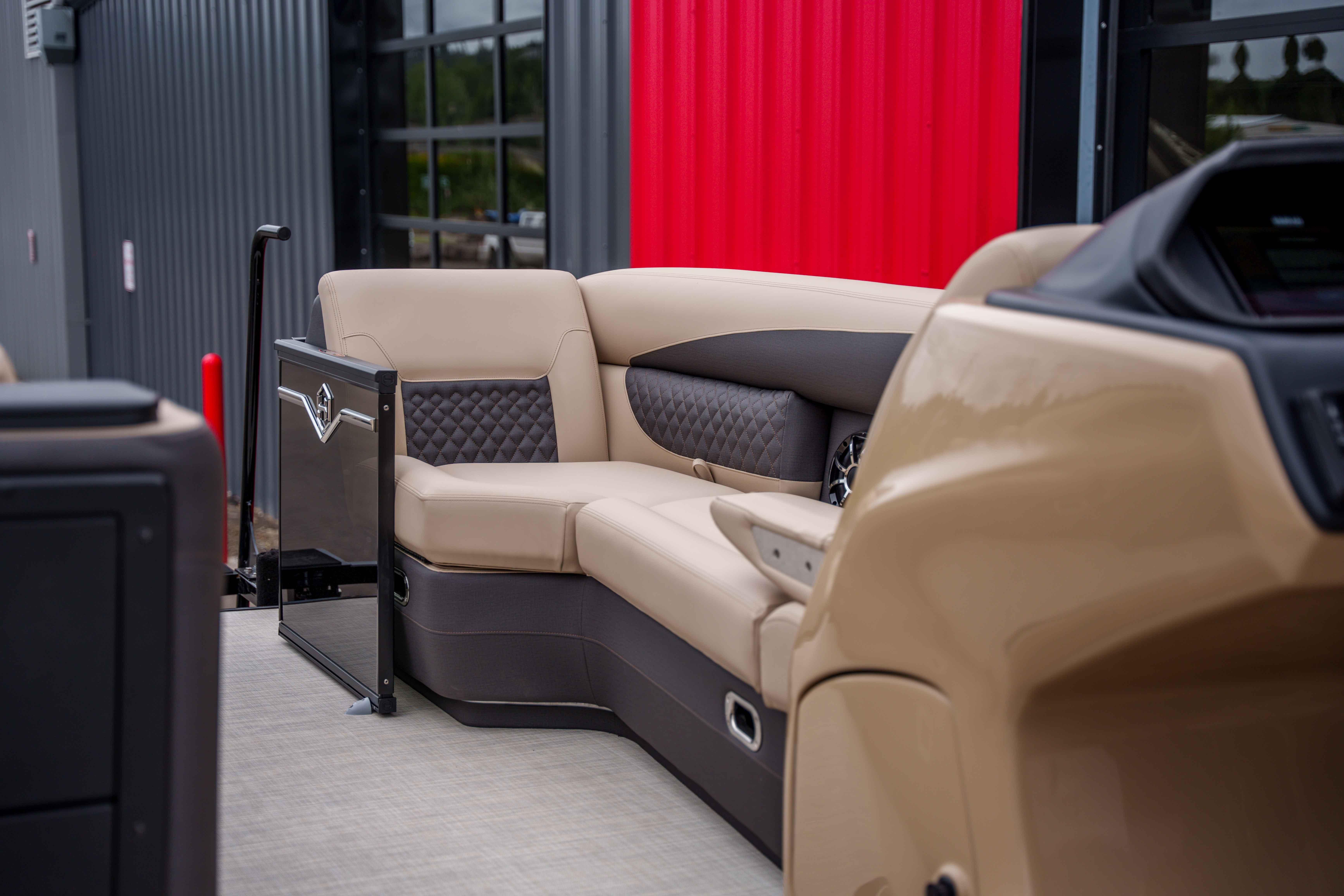 Luxurious seating on 2026 Harris Sunliner 230 pontoon boat with modern design and comfort.