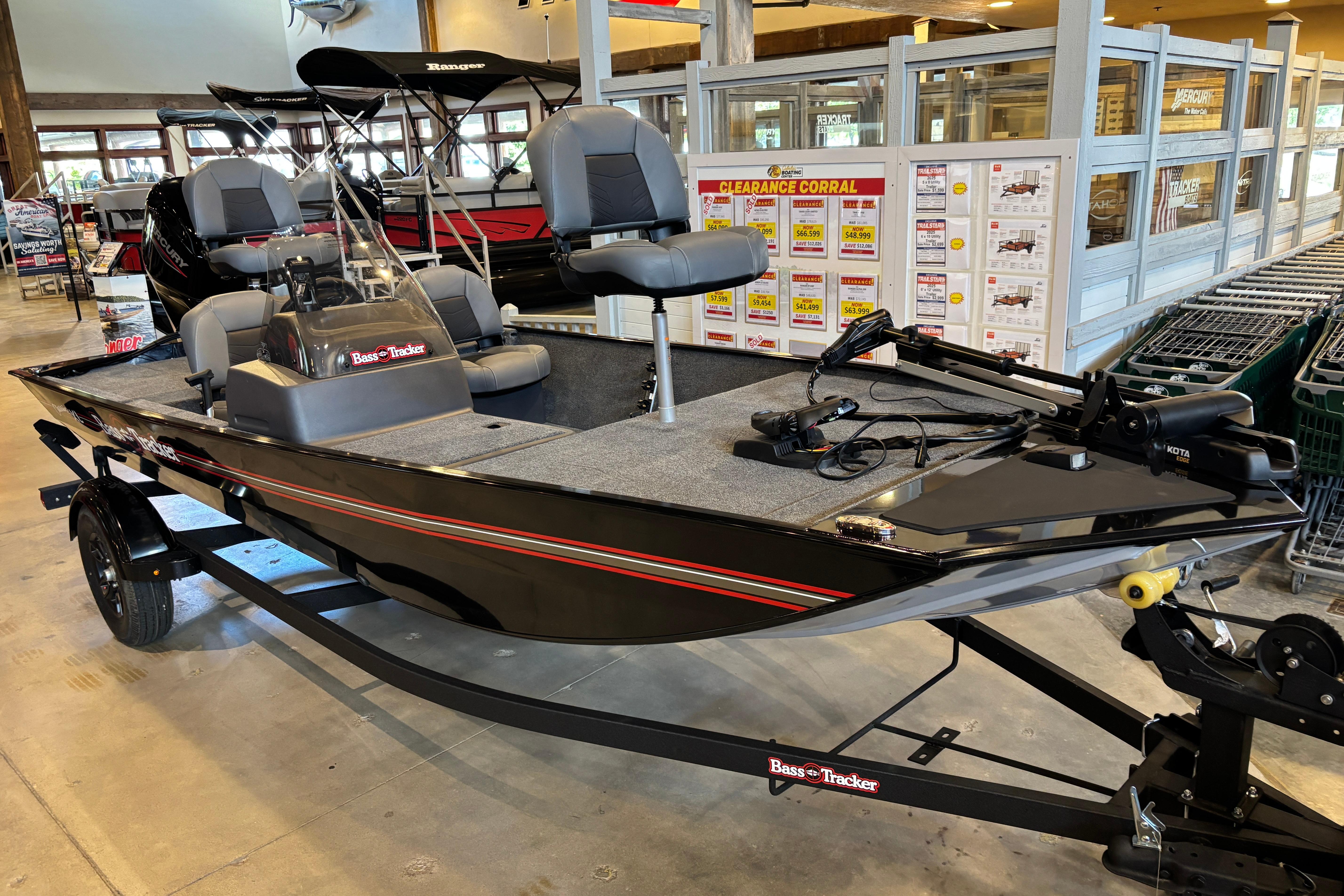 2026 Tracker Bass Tracker Classic XL boat displayed in a showroom.
