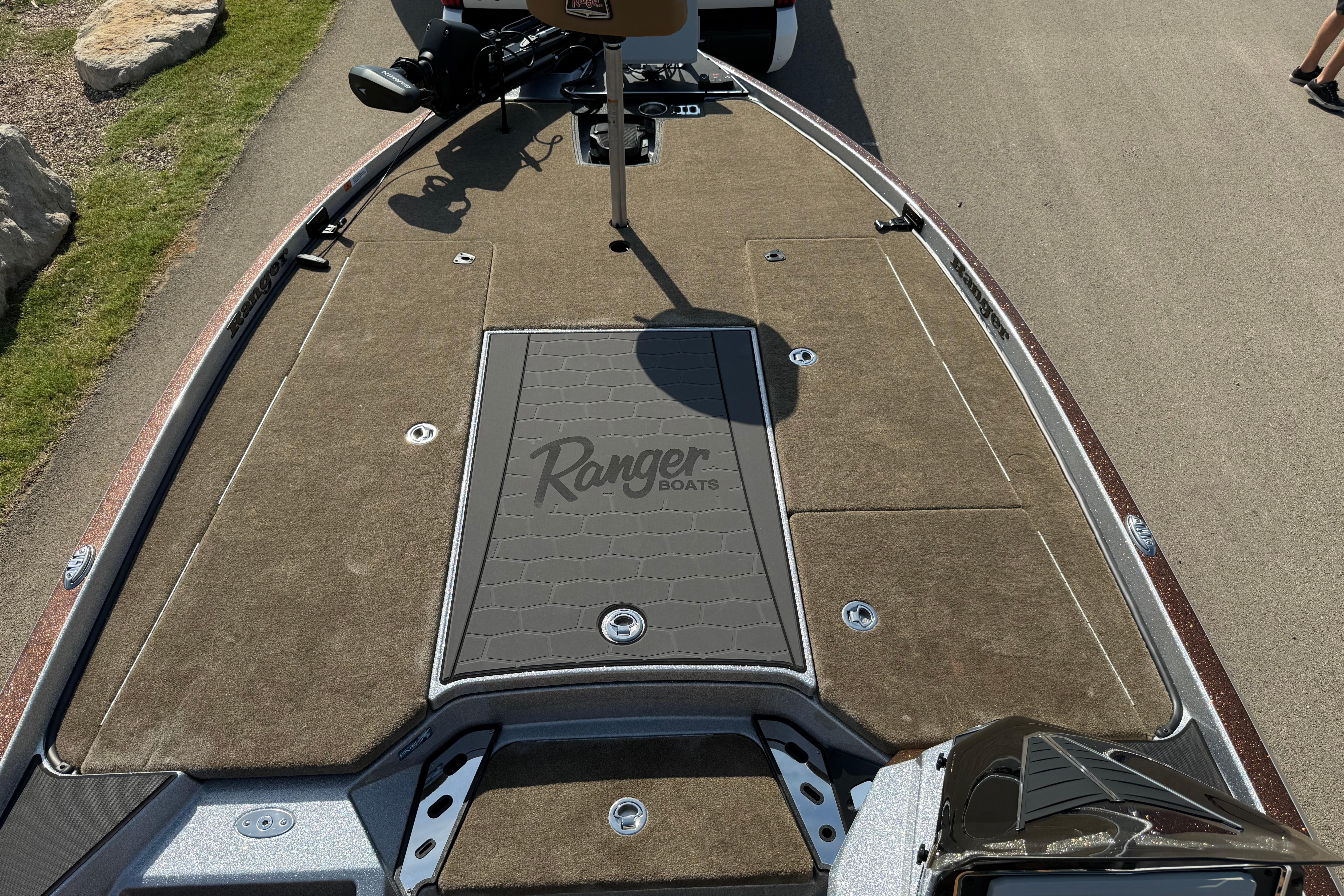 2026 Ranger Z521R boat deck with brown carpeting and storage compartments.