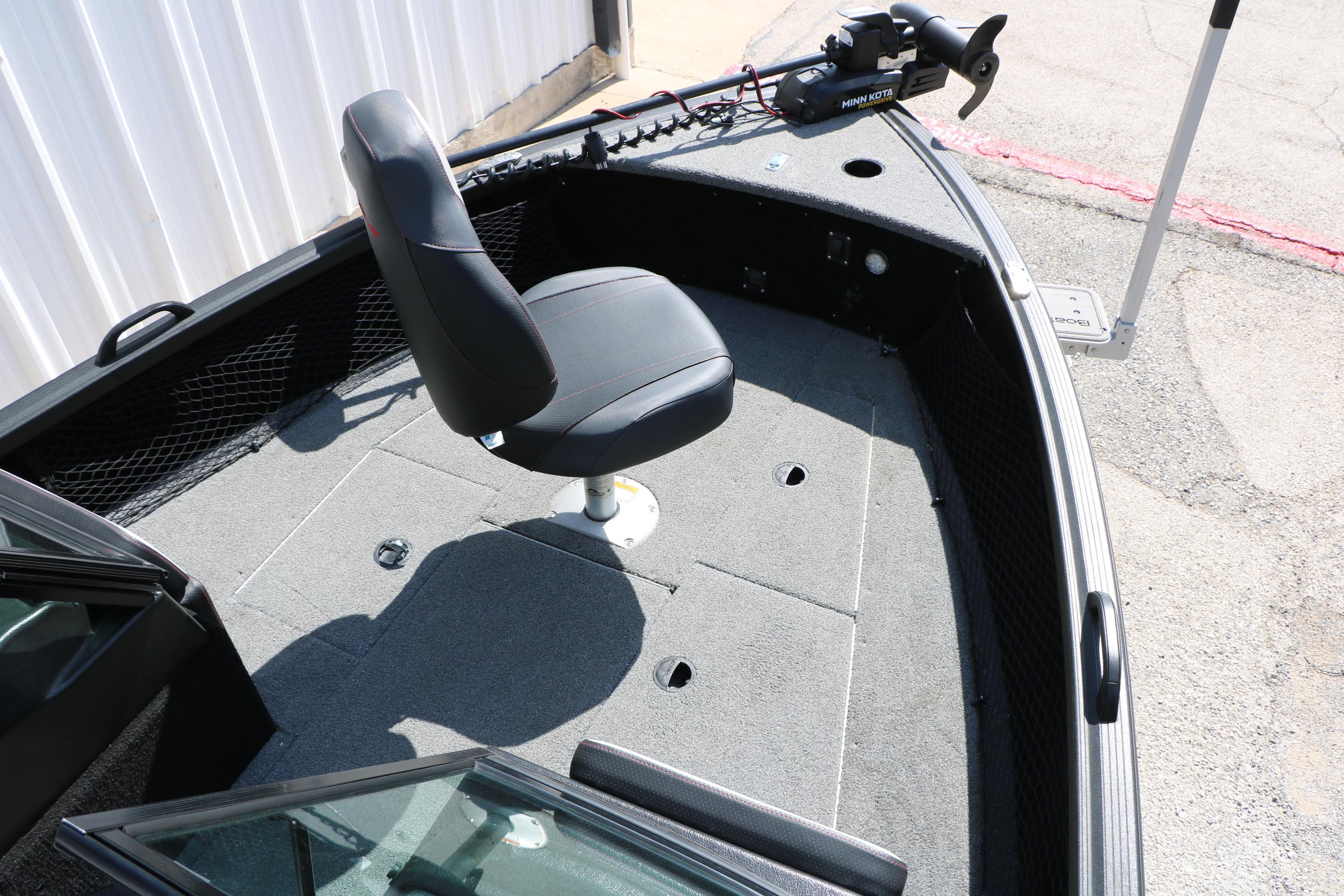 2023 Alumacraft Competitor FSX 185 boat interior with swivel seat and trolling motor.
