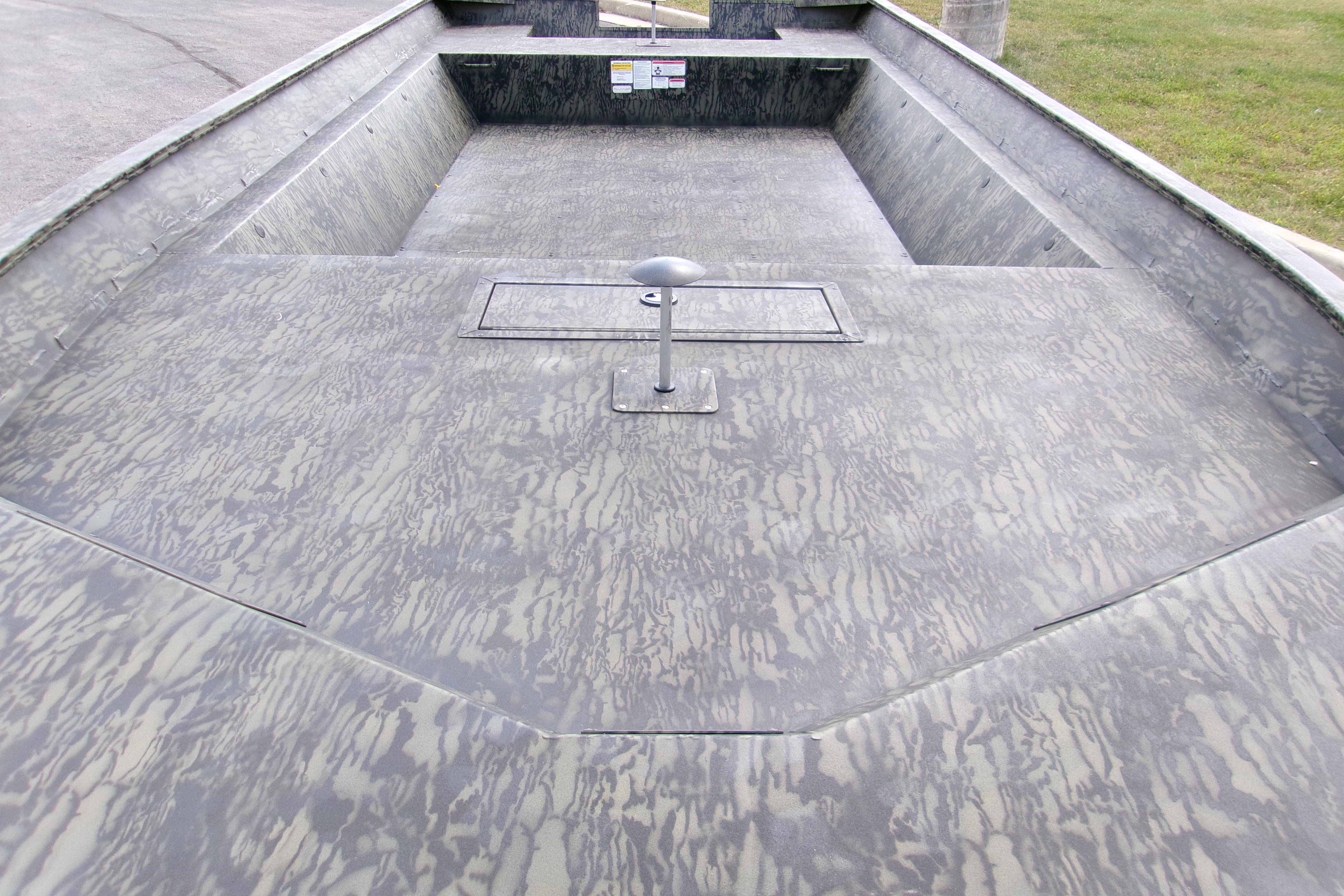 2026 Tracker Grizzly 2072 Utility boat interior with textured flooring and open deck design.