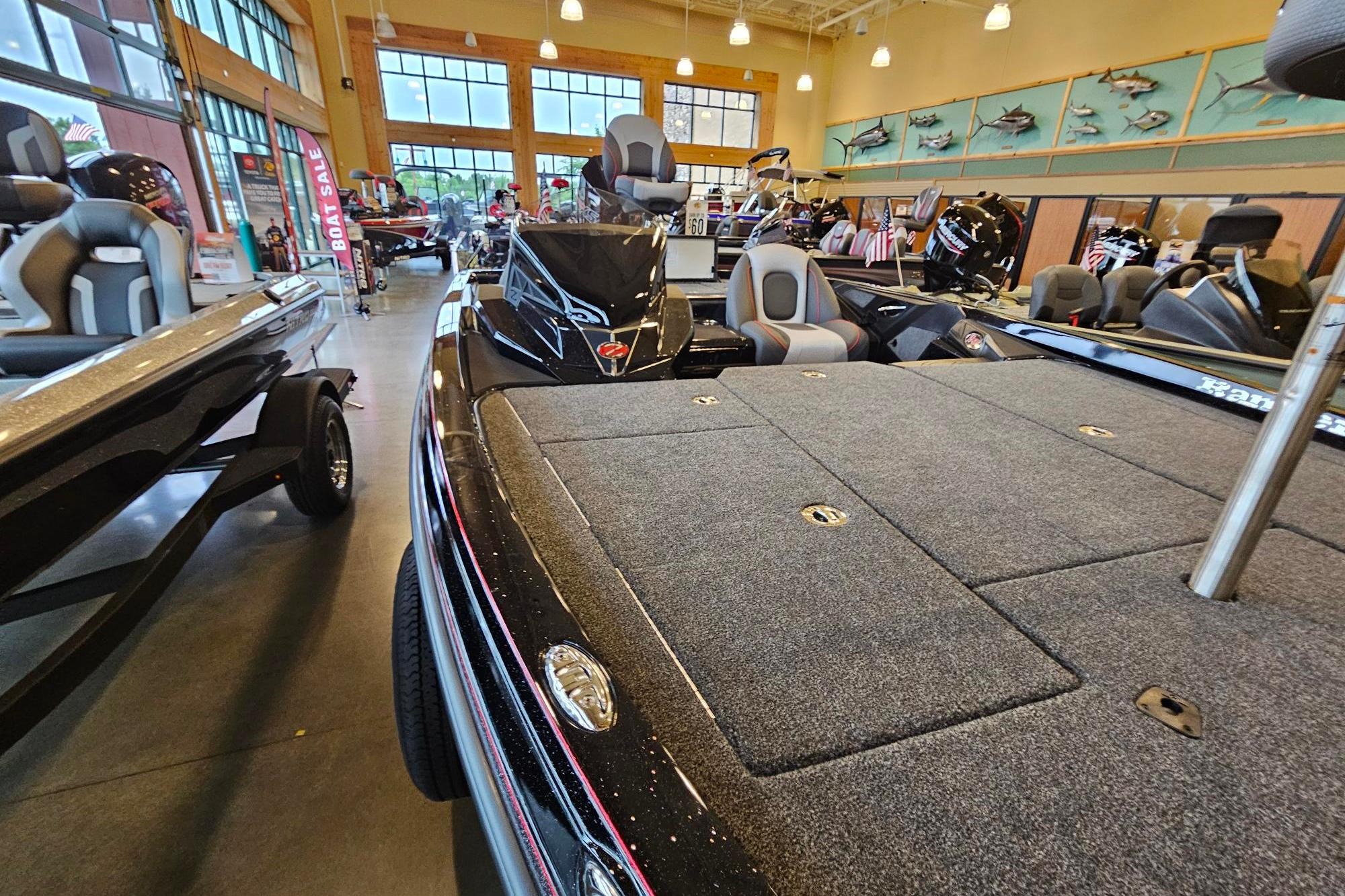 2026 Ranger Z518 Cup-Equipped boat displayed in a showroom with fishing gear.
