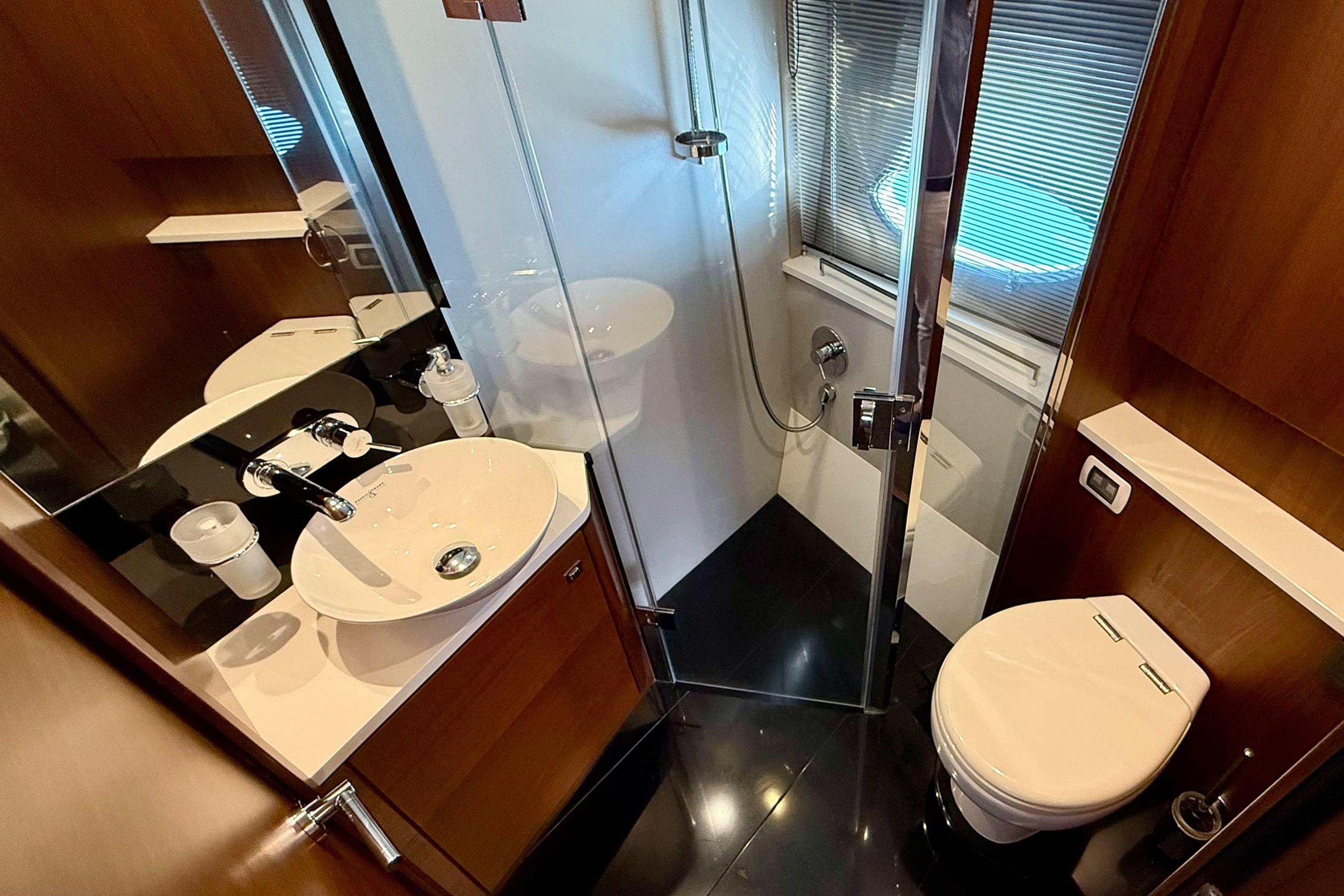 Luxurious bathroom in 2015 Princess V48 yacht with modern fixtures and elegant design.