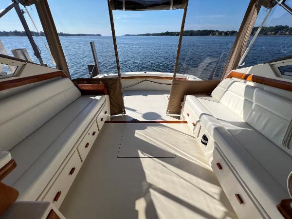 The image shows the cockpit of a 1985 Viking 35 Express overlooking the water.