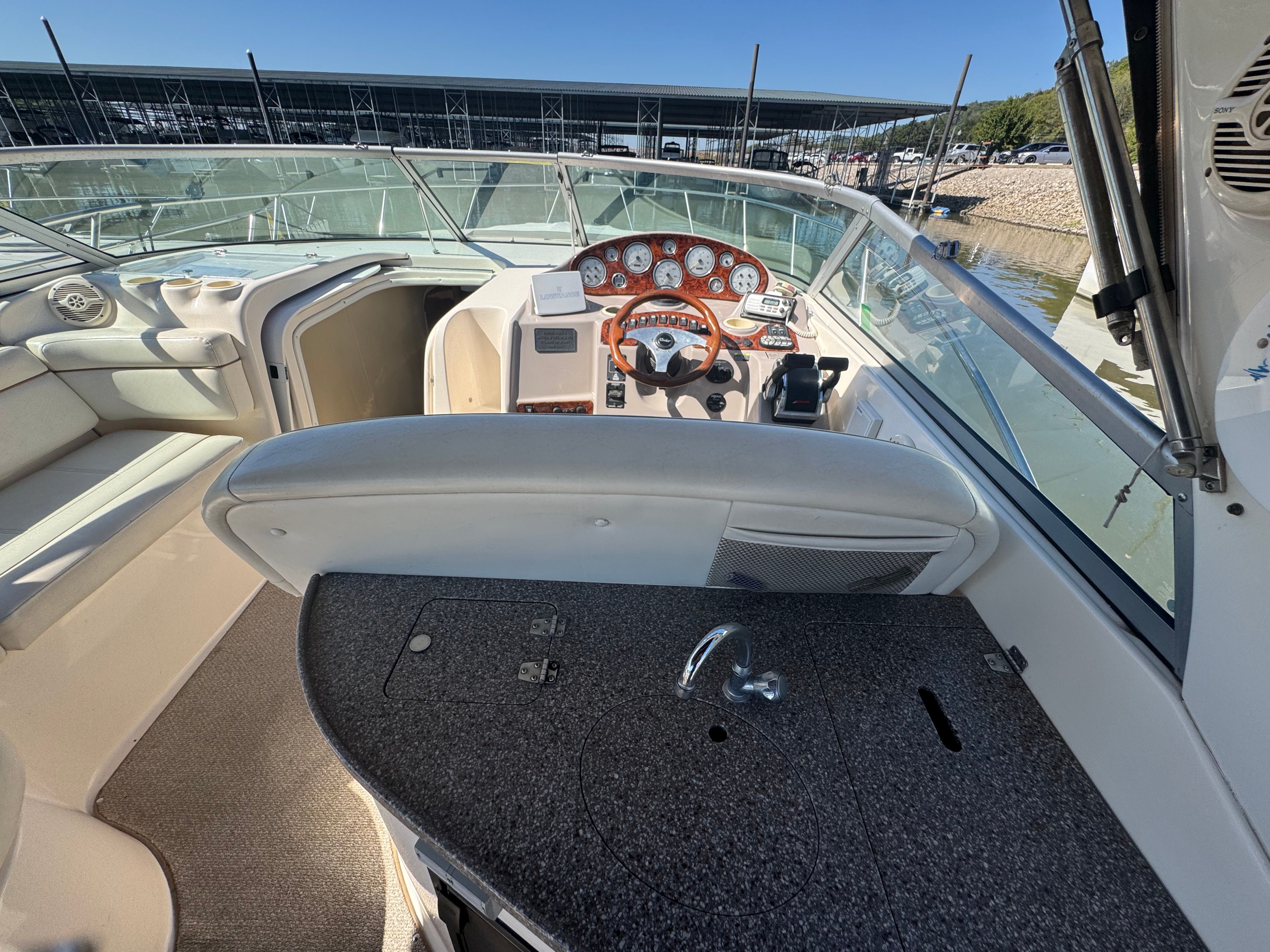 Interior of a 2005 Rinker Fiesta Vee 342 boat, cockpit view.