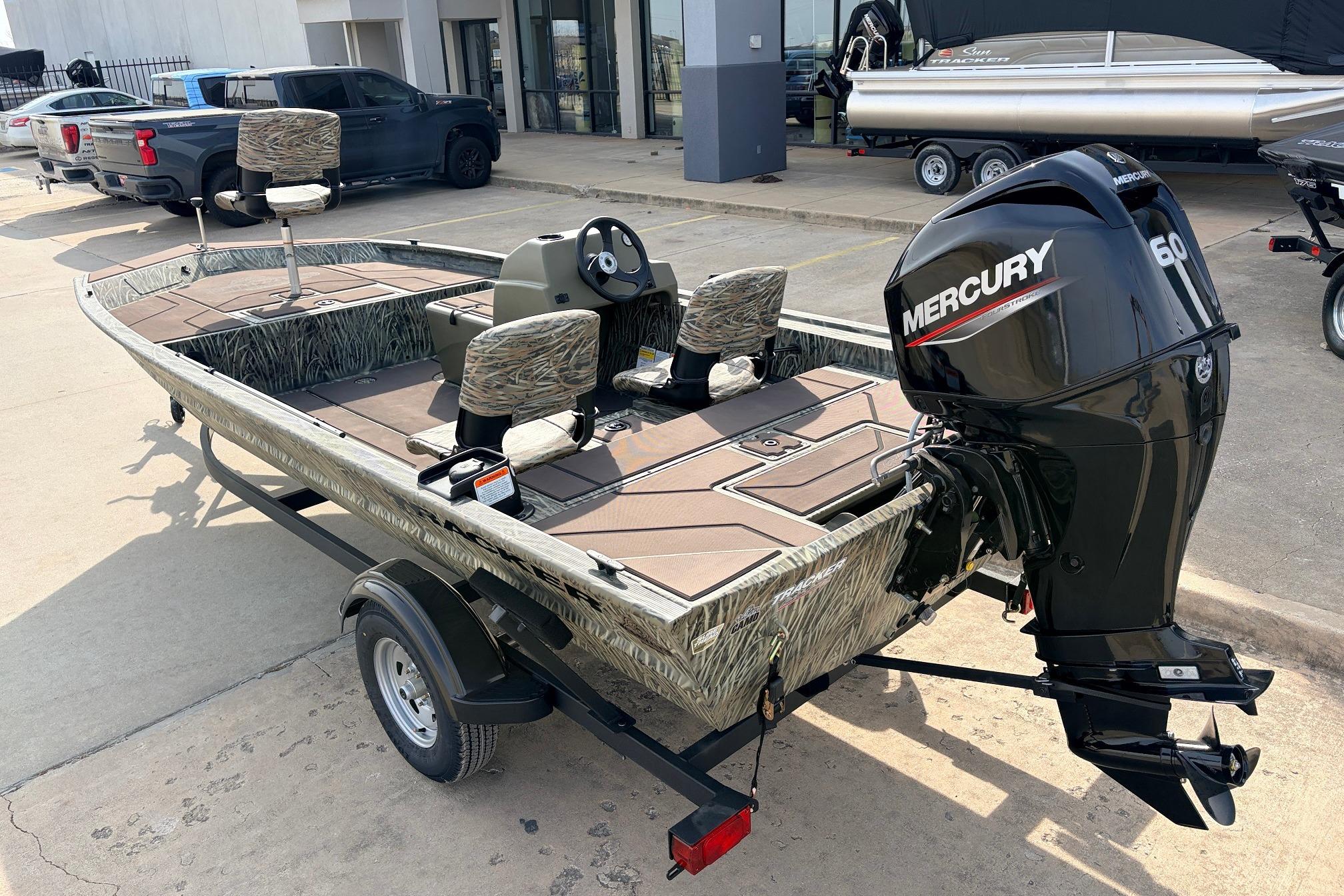 2026 Tracker Grizzly 1754 SC boat with Mercury 60 engine, parked on trailer.