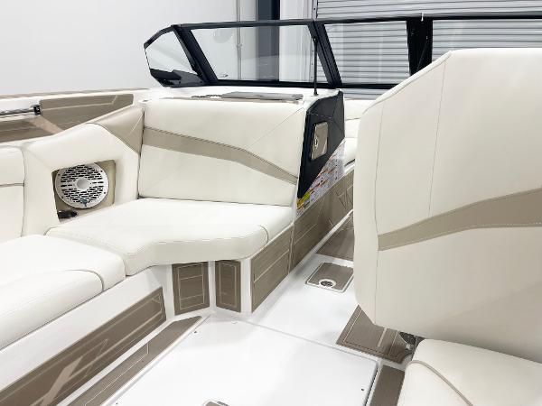 Luxurious interior of 2025 Centurion NV213 boat with beige seating and modern design.
