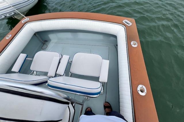 1988 Strike 26 Center Console boat interior with cushioned seating and wooden trim.