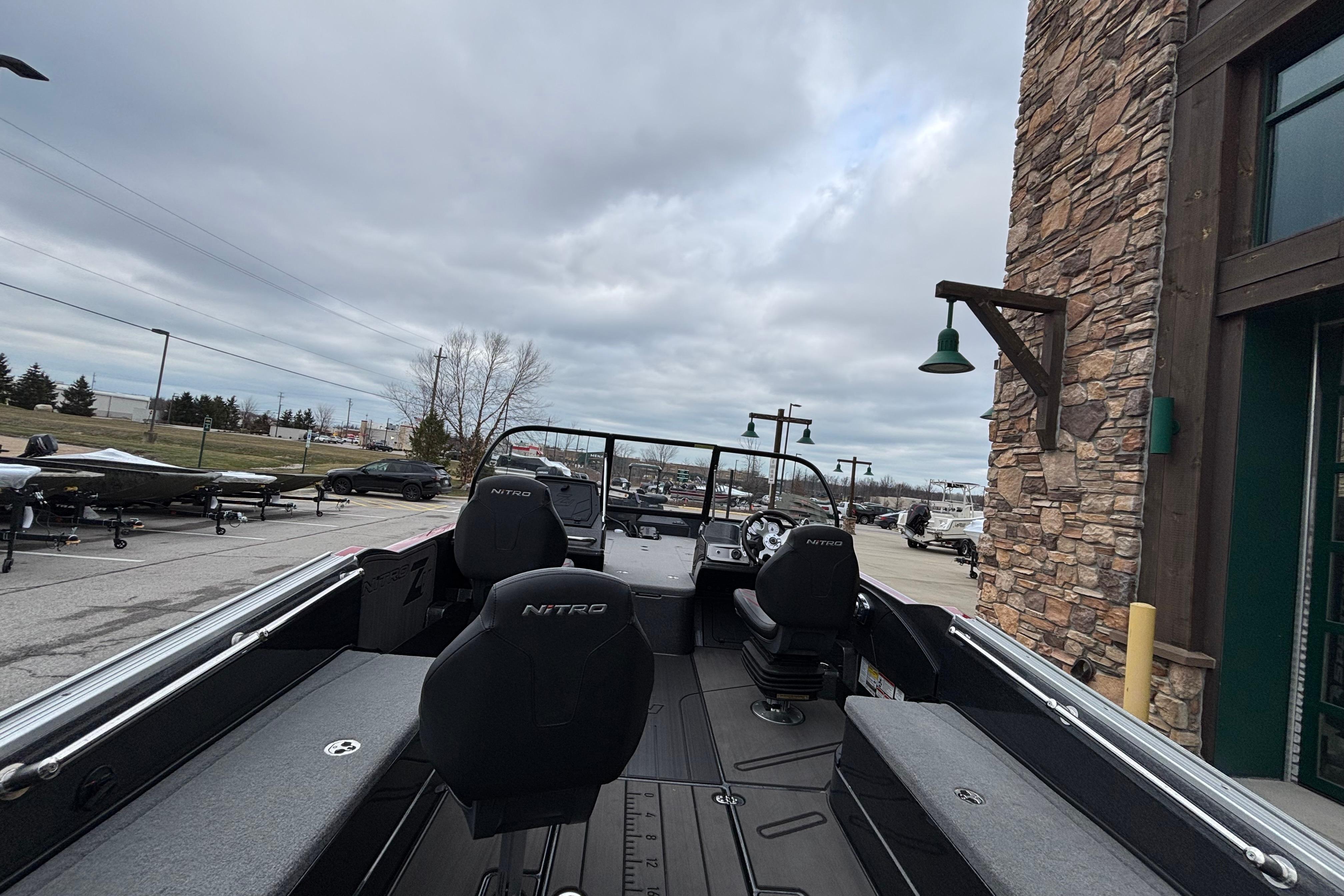 2024 Nitro ZV21 Pro boat parked outside, showcasing sleek design and spacious interior.