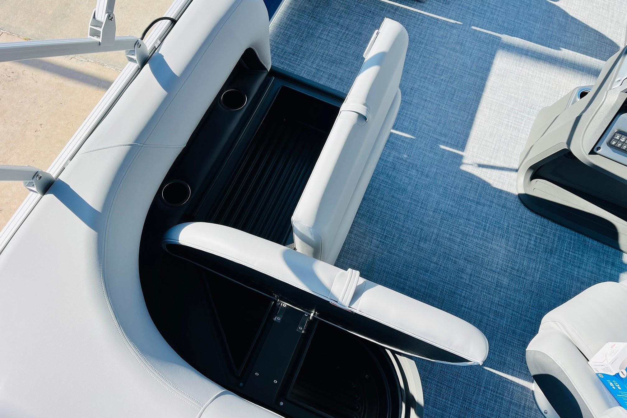 2026 Sun Tracker Party Barge 18 DLX interior with seating and storage compartments.