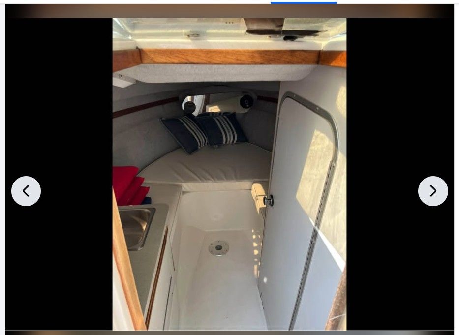 Interior of a 1990 Regal Valante 225C boat with sleeping area.