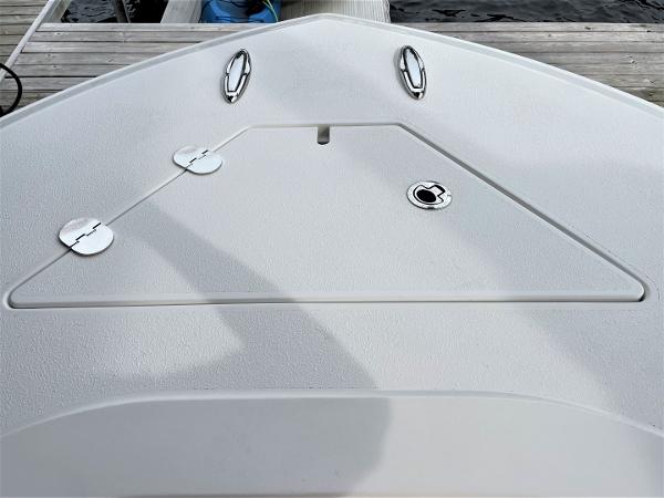 2020 Front Runner 39 Center Console boat deck with hatches and cleats at dock.