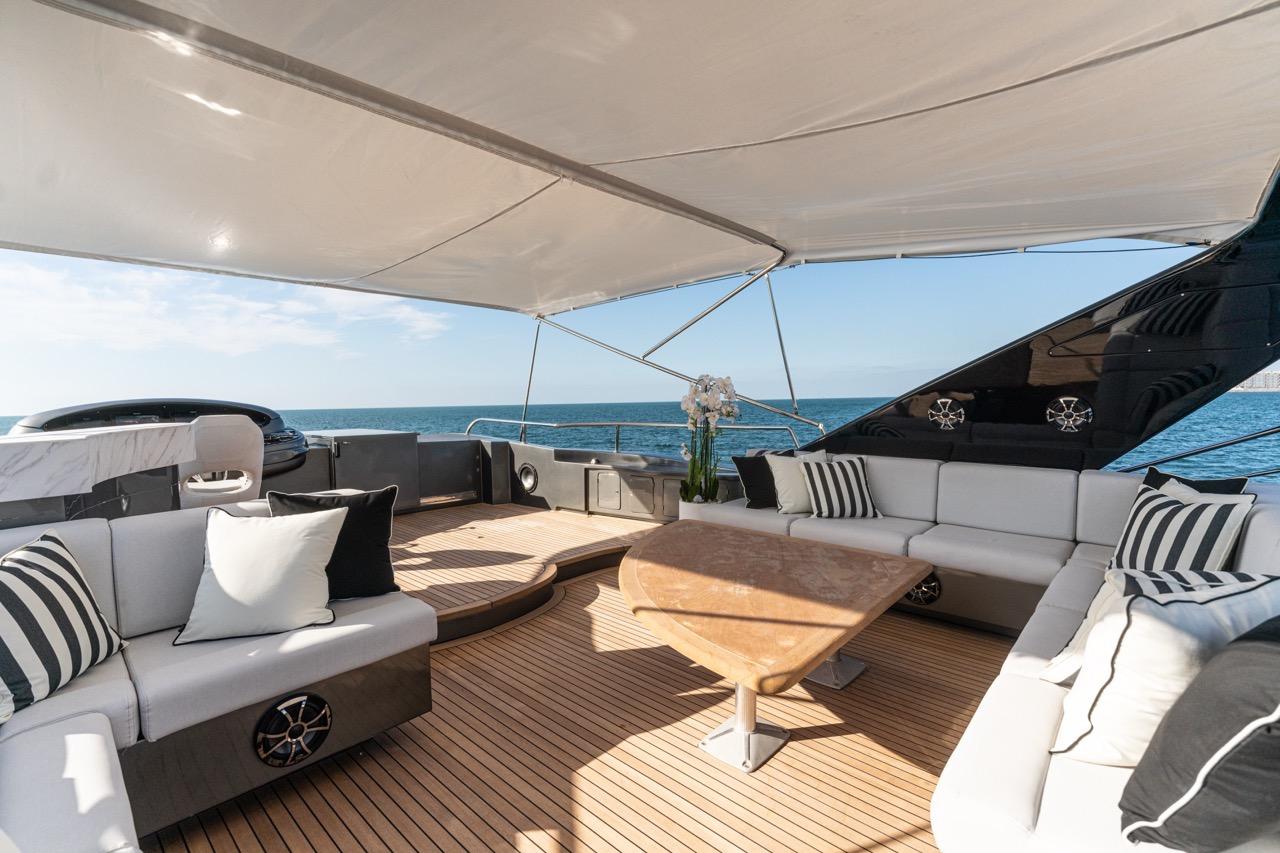 Luxurious 2004 Azimut 100 Jumbo yacht deck with elegant seating and ocean view.
