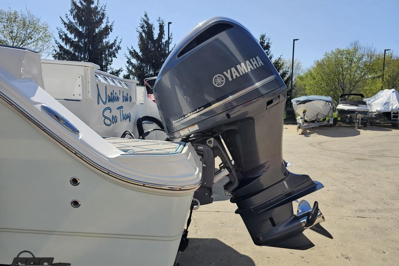 2013 Sea Fox 286 Commander with Yamaha outboard motor in a sunny outdoor setting.