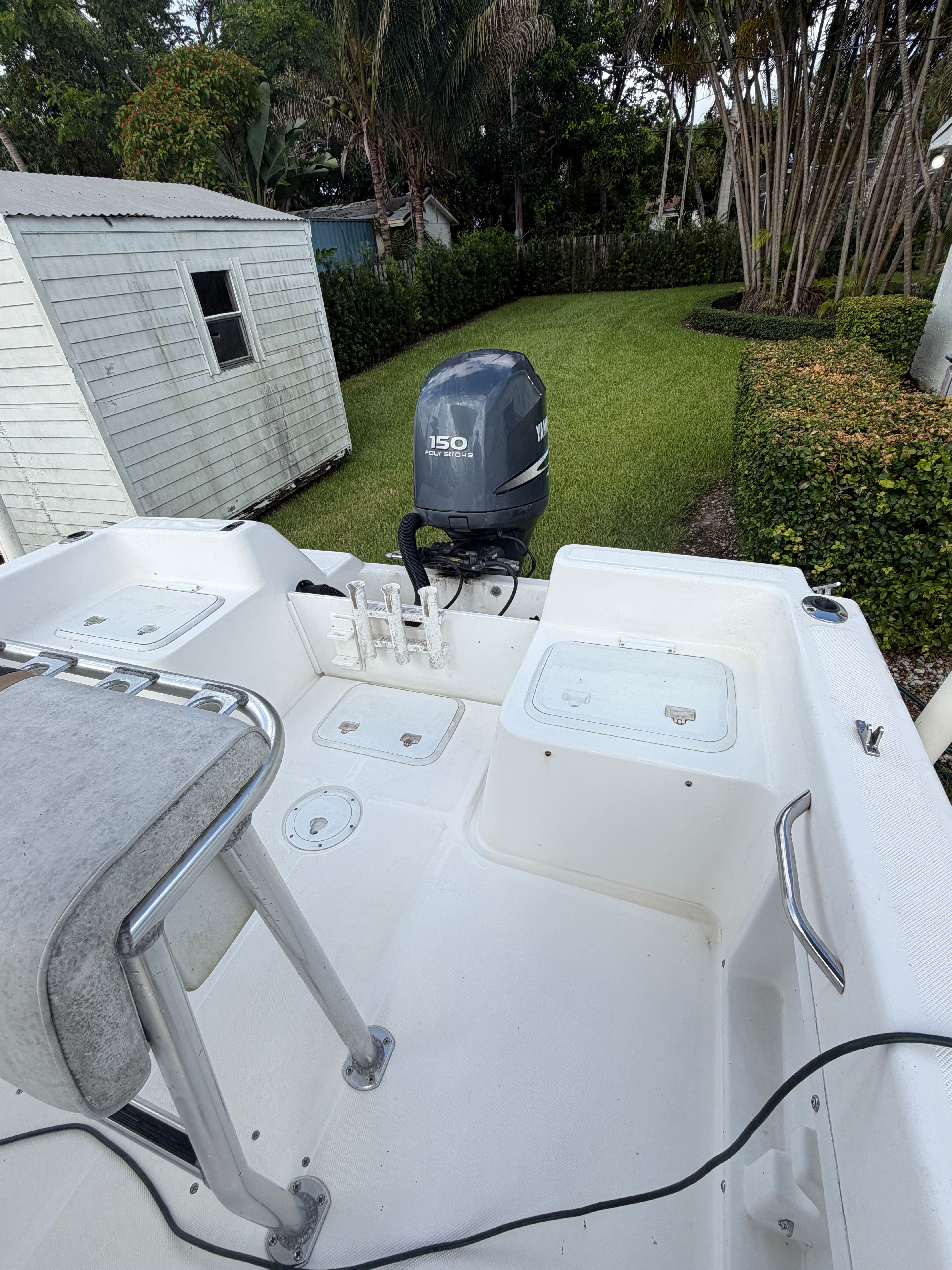 The image shows the stern of a 2001 Century 2100 Center Console boat with an outboard motor.