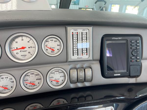 Dashboard of a 2005 Cobalt 343 boat with gauges and Garmin GPS.