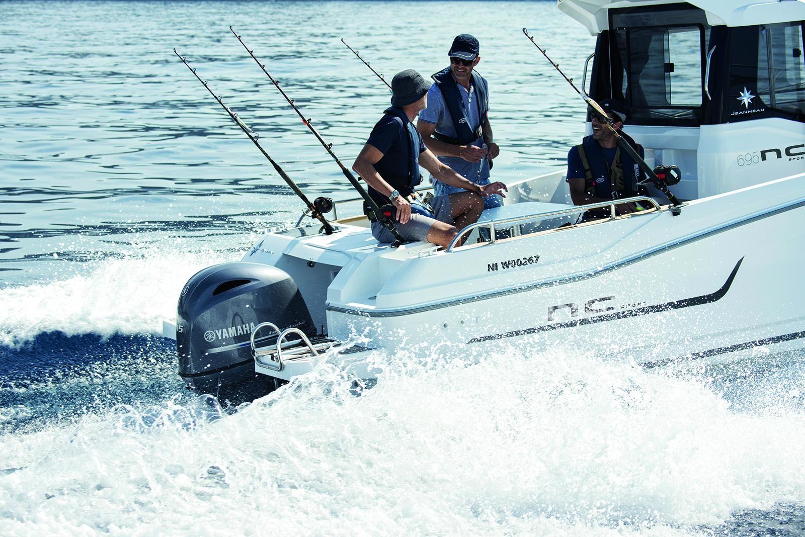 2024 Jeanneau NC 695 Sport boat with people fishing, Yamaha engine, on the water.