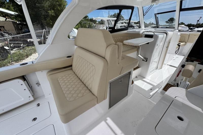 Luxurious interior of 2026 Southport 33 DC boat with beige seating and modern design.
