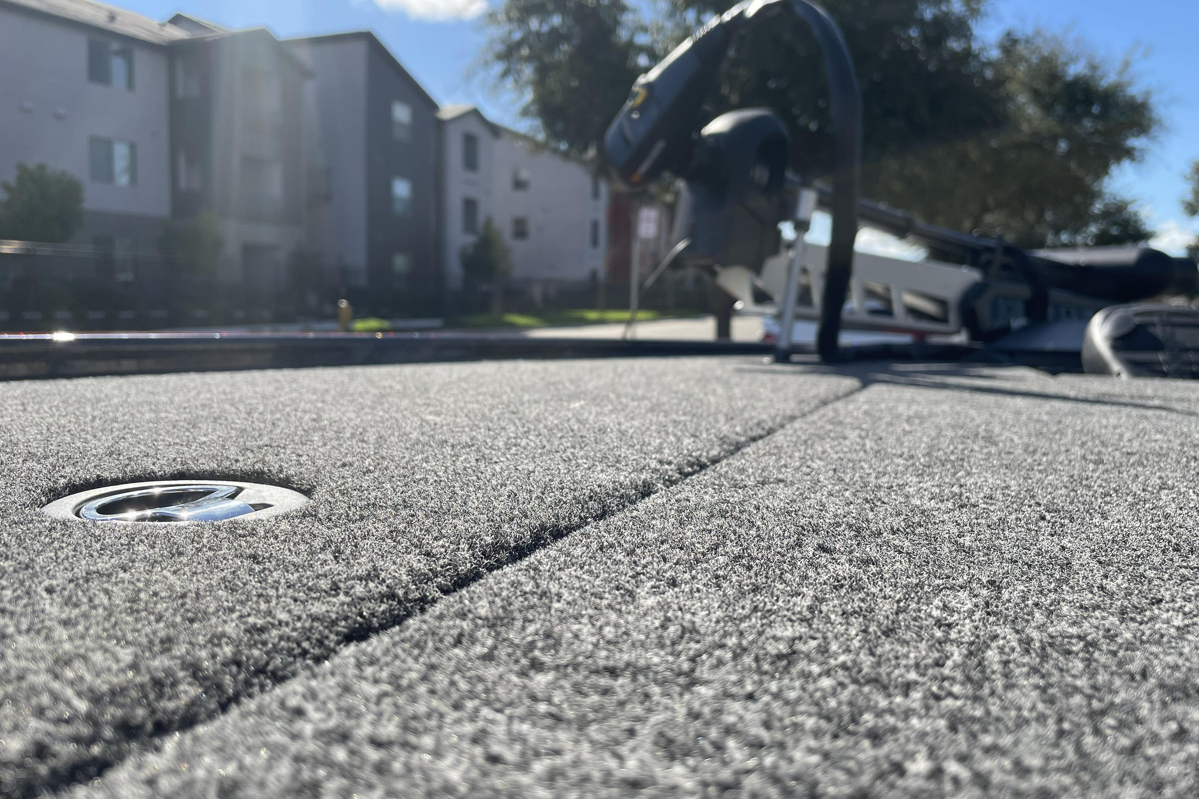 2026 Nitro Z19 XL boat deck with textured surface, residential background.