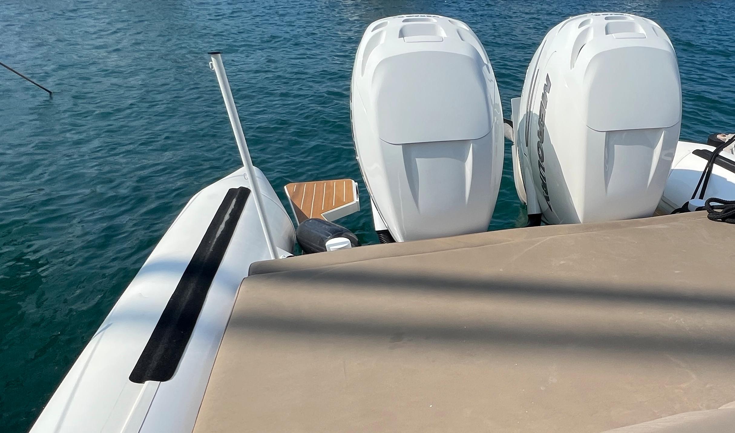 Rafnar 1200 T-TOP 2021 boat with dual engines on calm water.