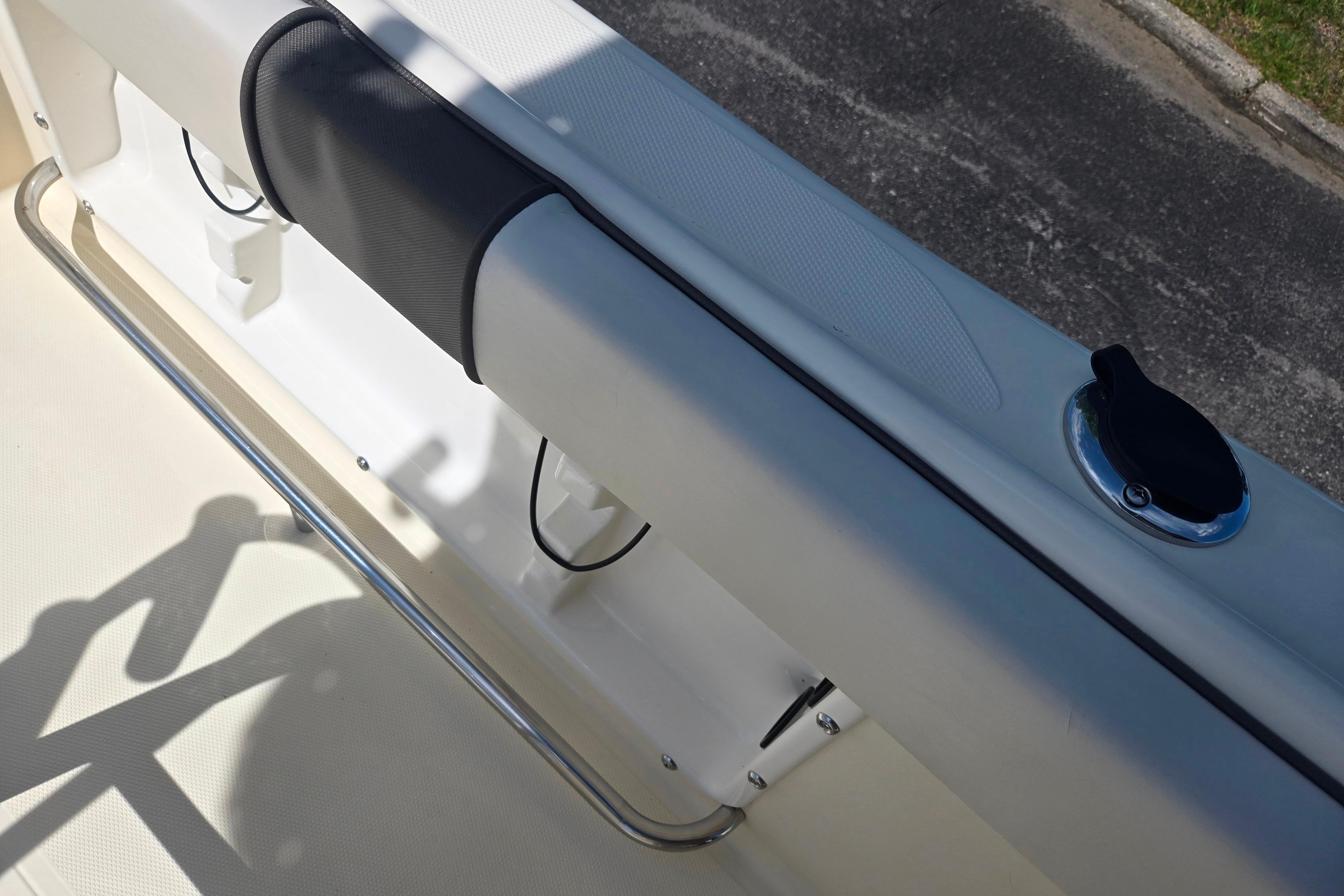 Interior view of a 2016 Key Largo 2000CC boat, featuring seating and railing.
