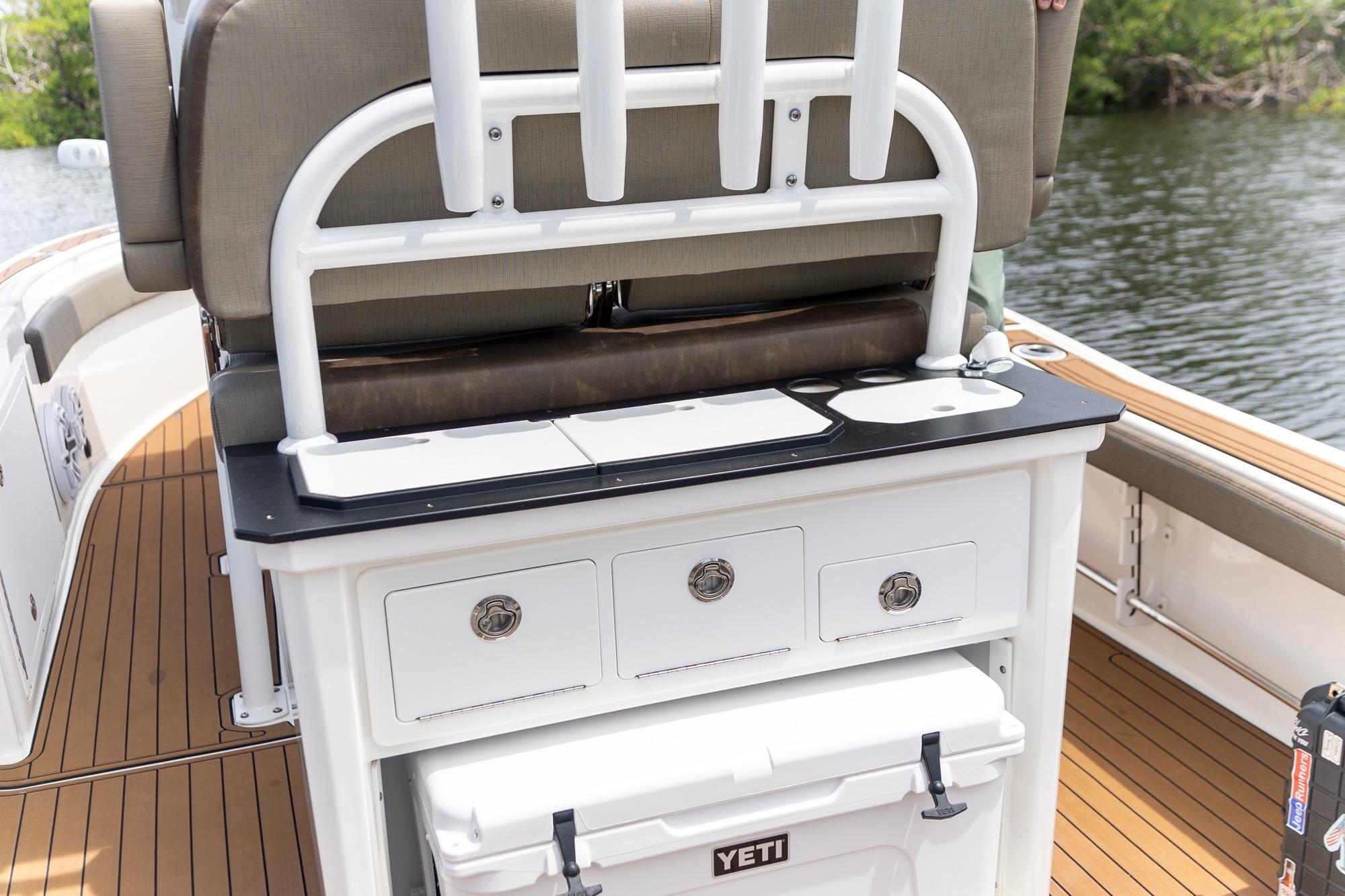 2022 Crevalle 26 HBW boat interior with seating, storage, and Yeti cooler on deck.