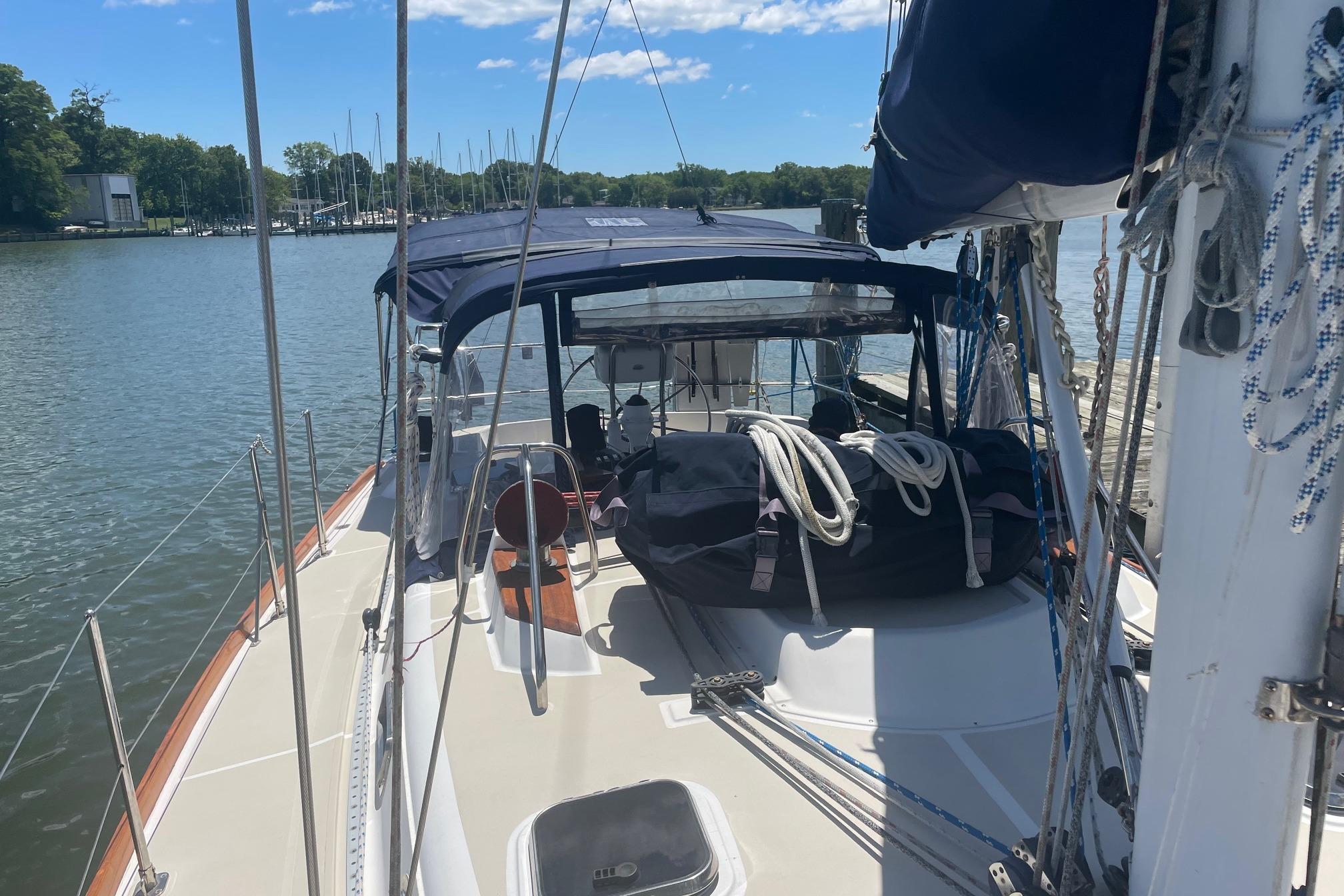 Sailboat Tartan 3700, 2001 model, docked on a sunny day with clear skies.