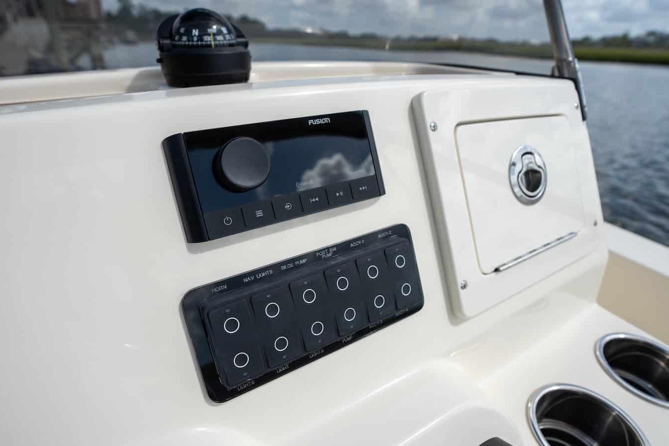 Control panel of 2026 Scout 188 Sportfish boat with navigation and audio system.