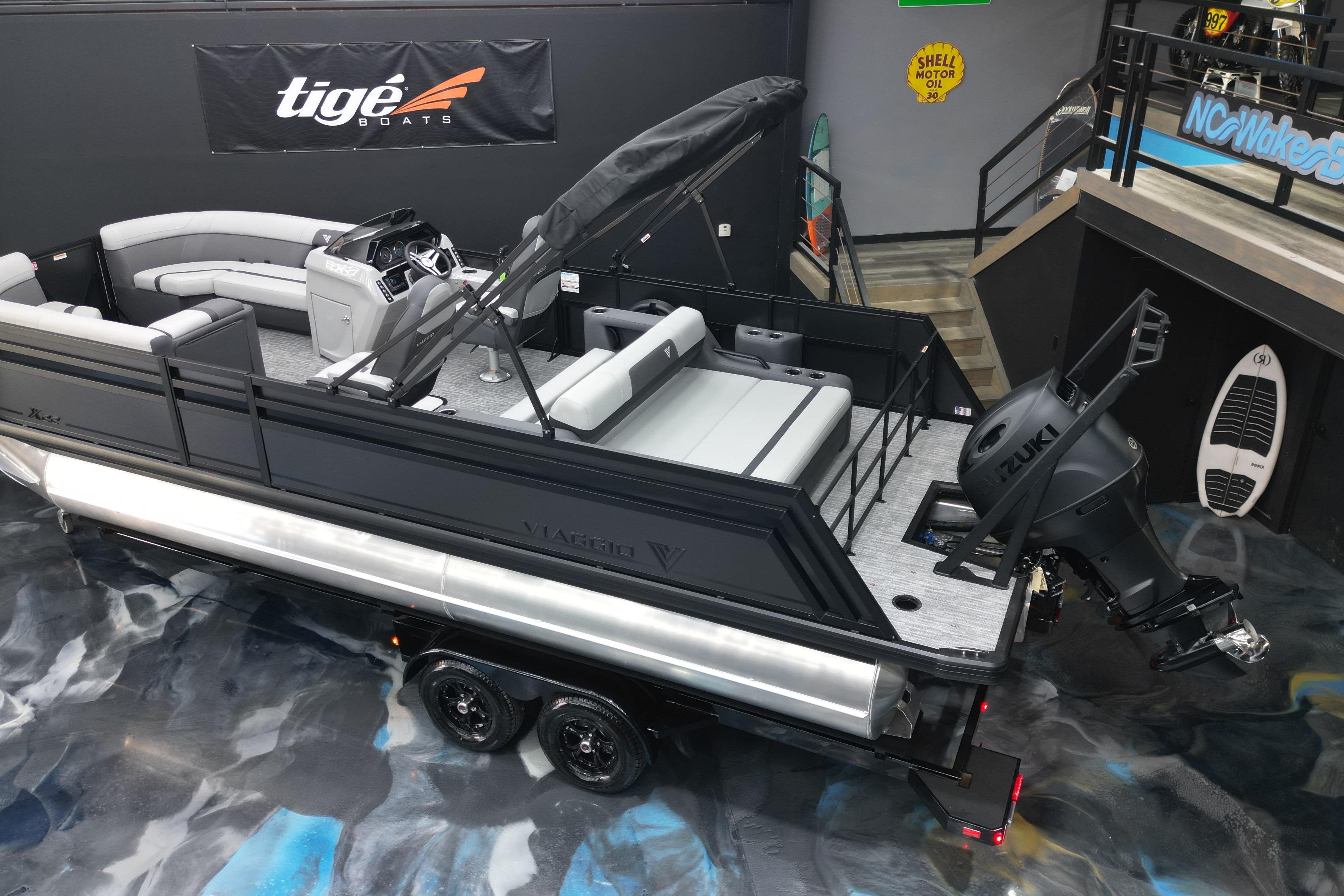 2026 Viaggio Lago X-S 22 pontoon boat with Suzuki engine in showroom display.