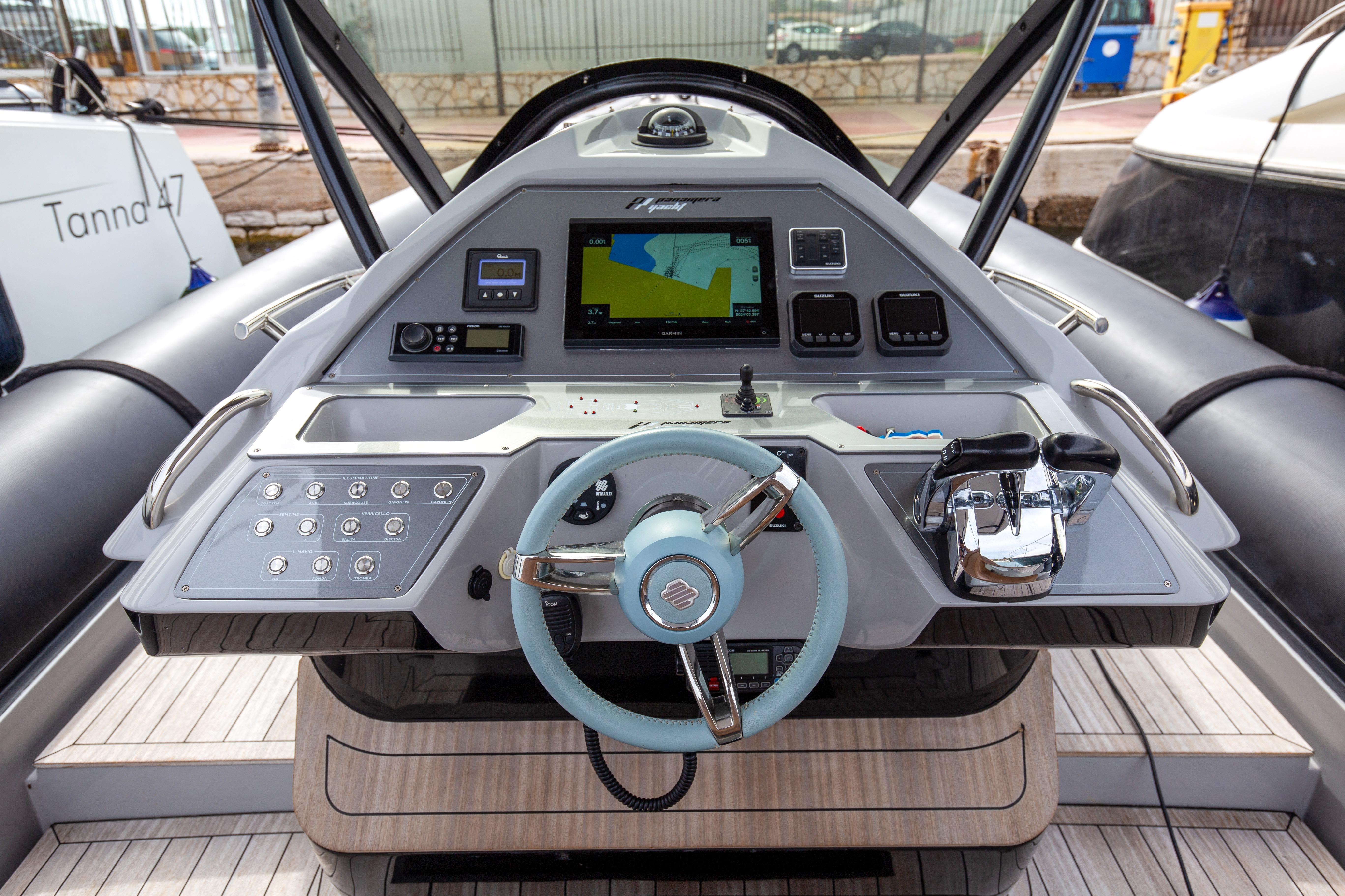 Control panel of 2021 Panamera Yacht PY100 with steering wheel and navigation display.