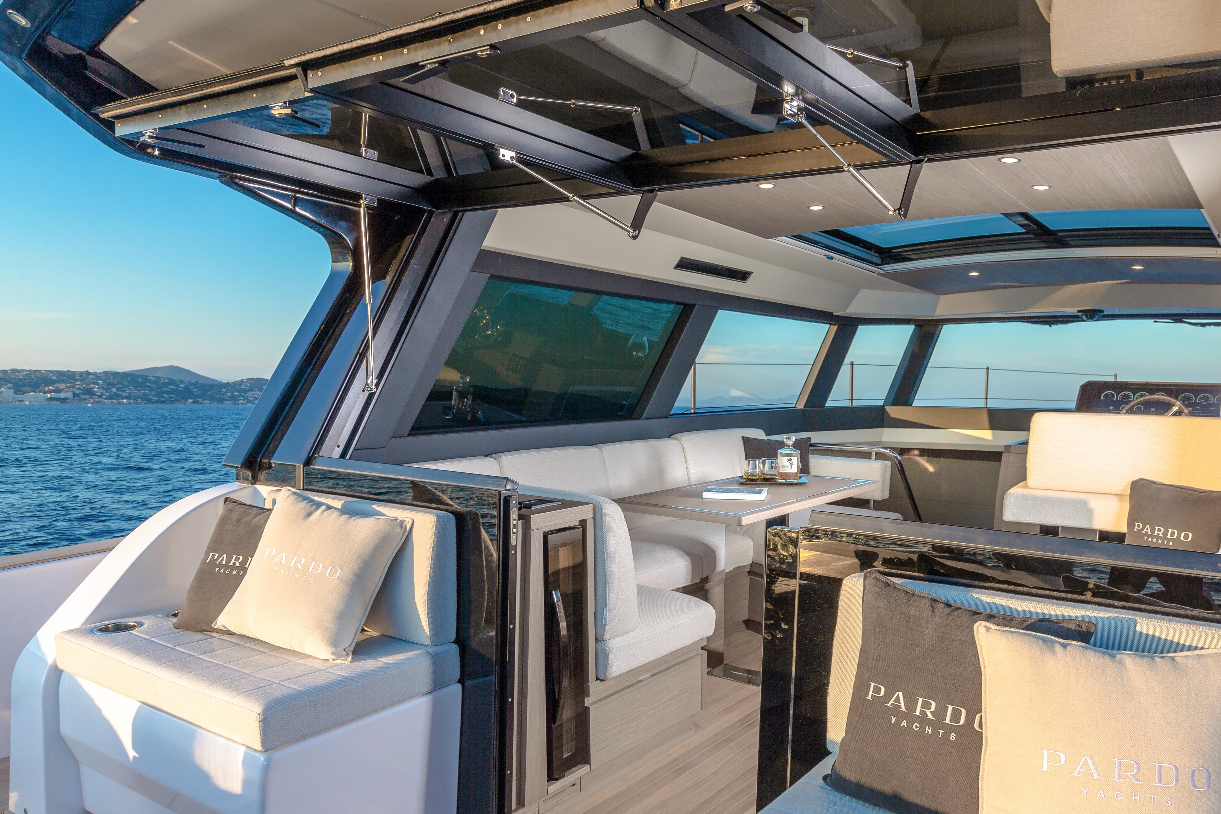 Luxurious interior of 2026 Pardo Yachts GT52 with elegant seating and ocean view.