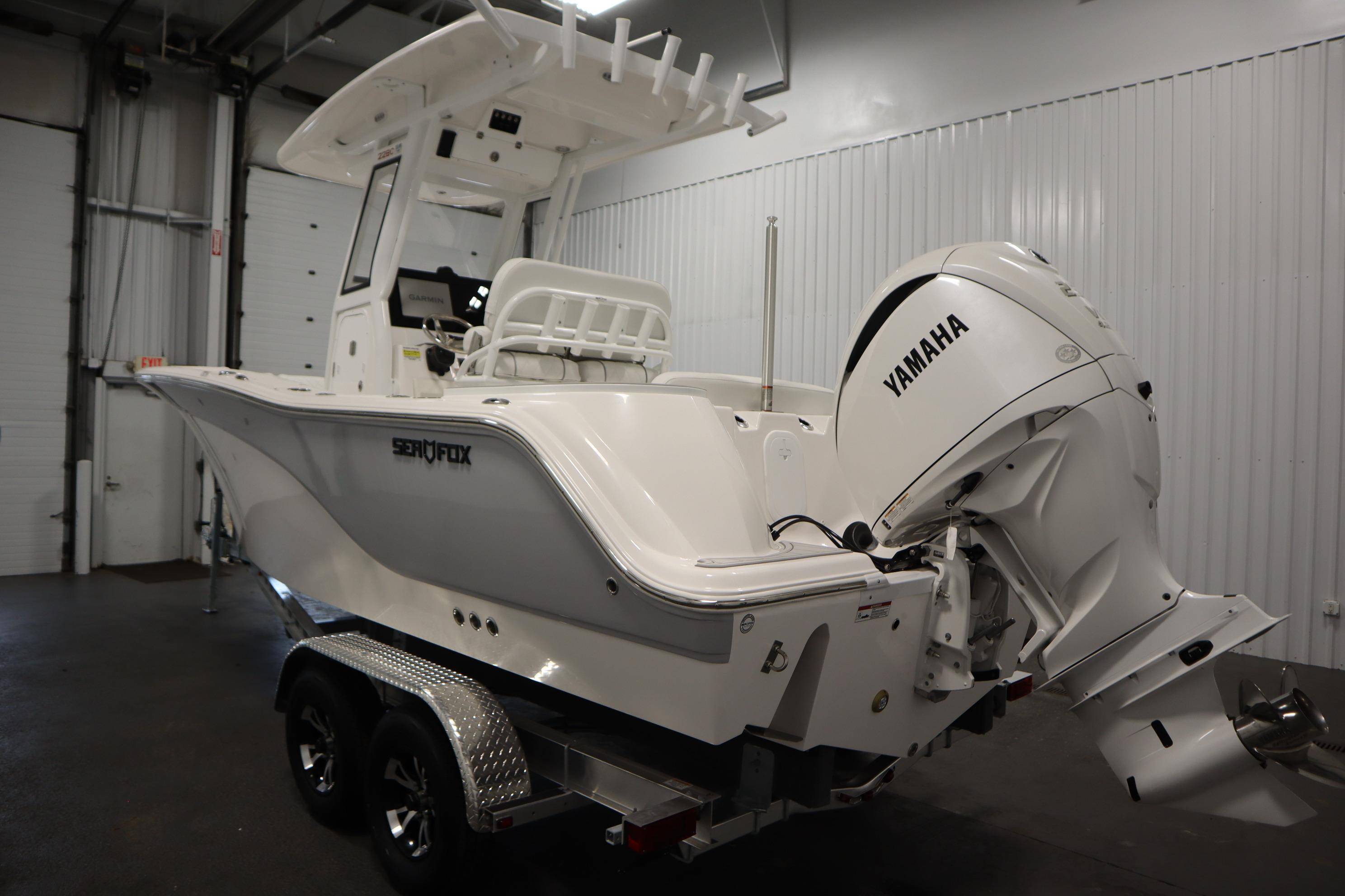 2026 Sea Fox 228 Commander boat with Yamaha engine in indoor storage.