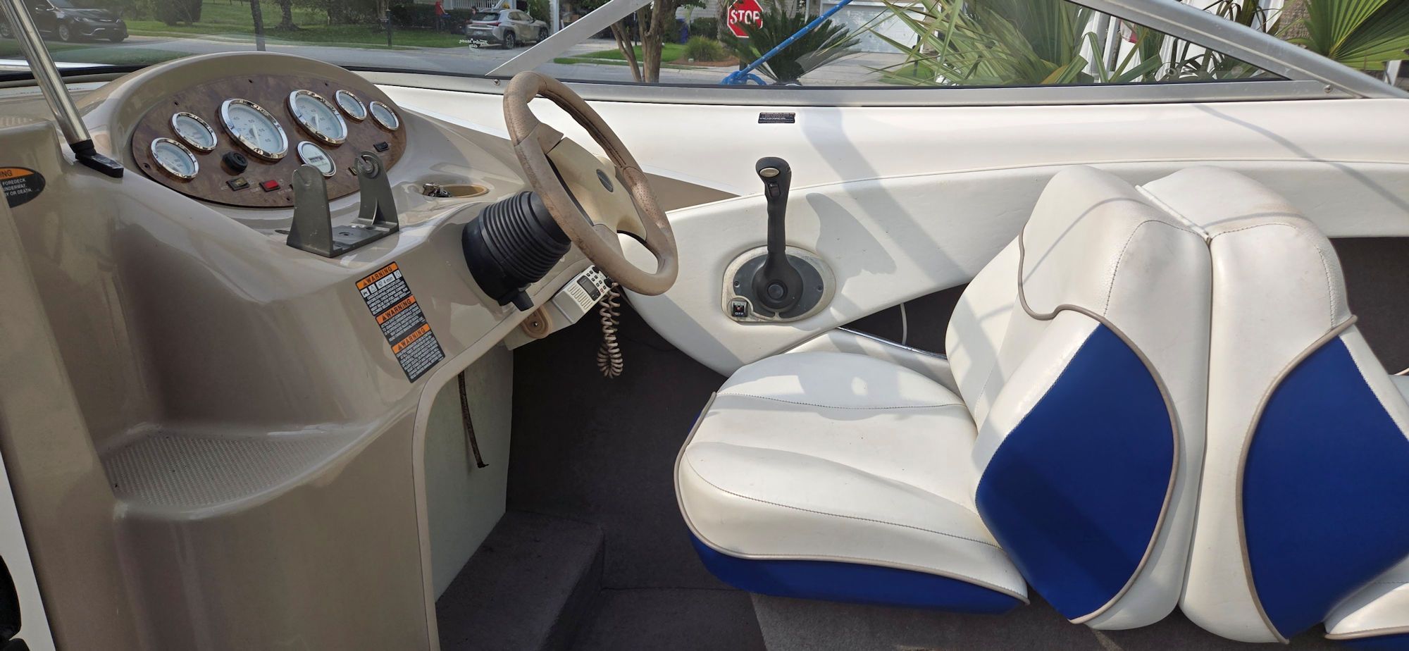 Interior of a 2004 Bayliner B210 Classic boat with steering console.
