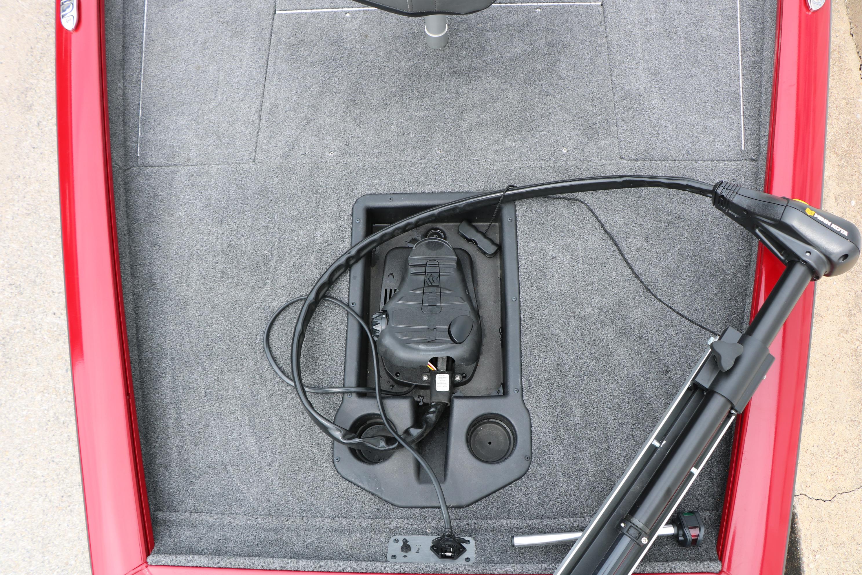 2024 Tracker Pro Team 175 boat deck with trolling motor and carpeted surface.