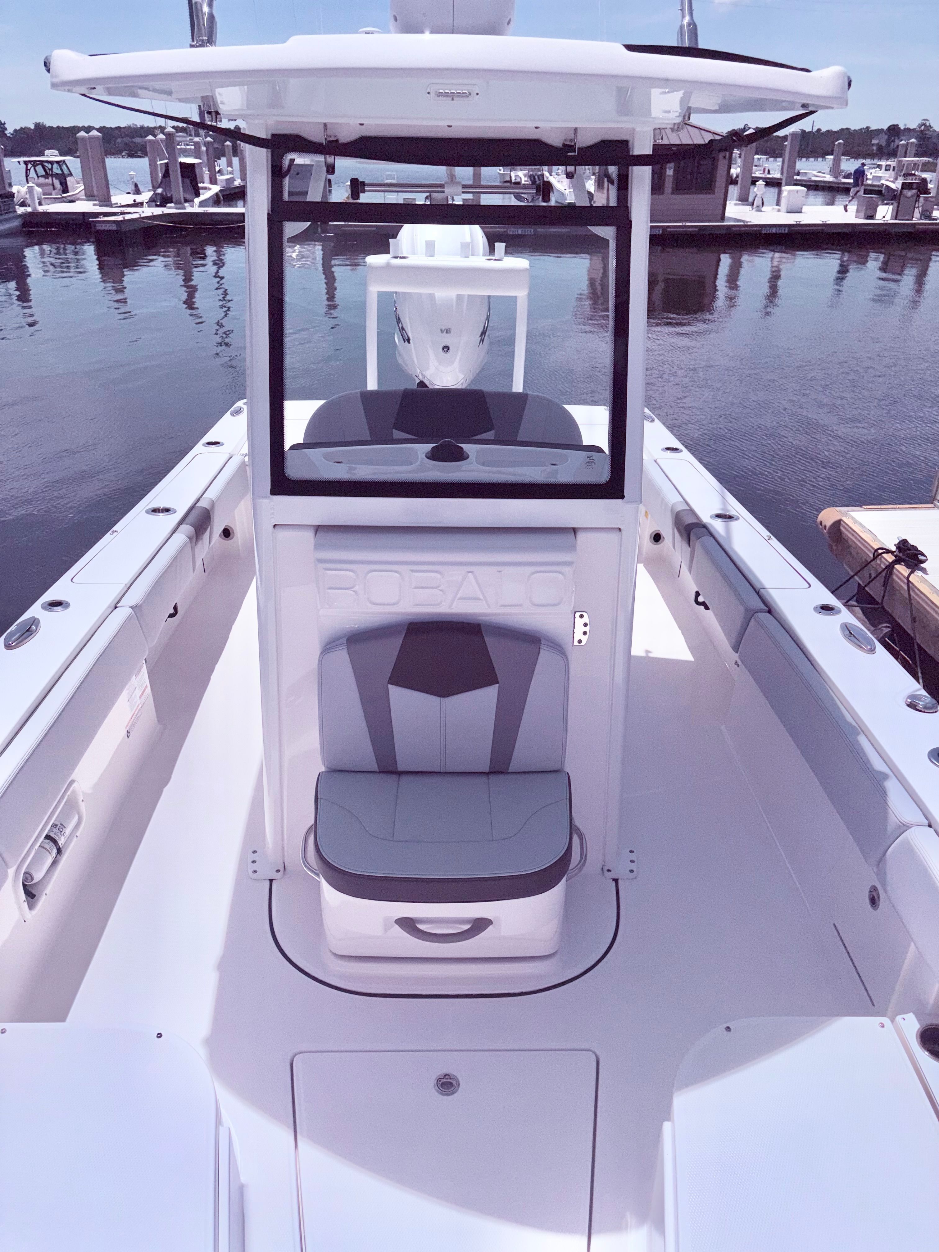 2025 Robalo 266 Cayman boat docked, sleek design.