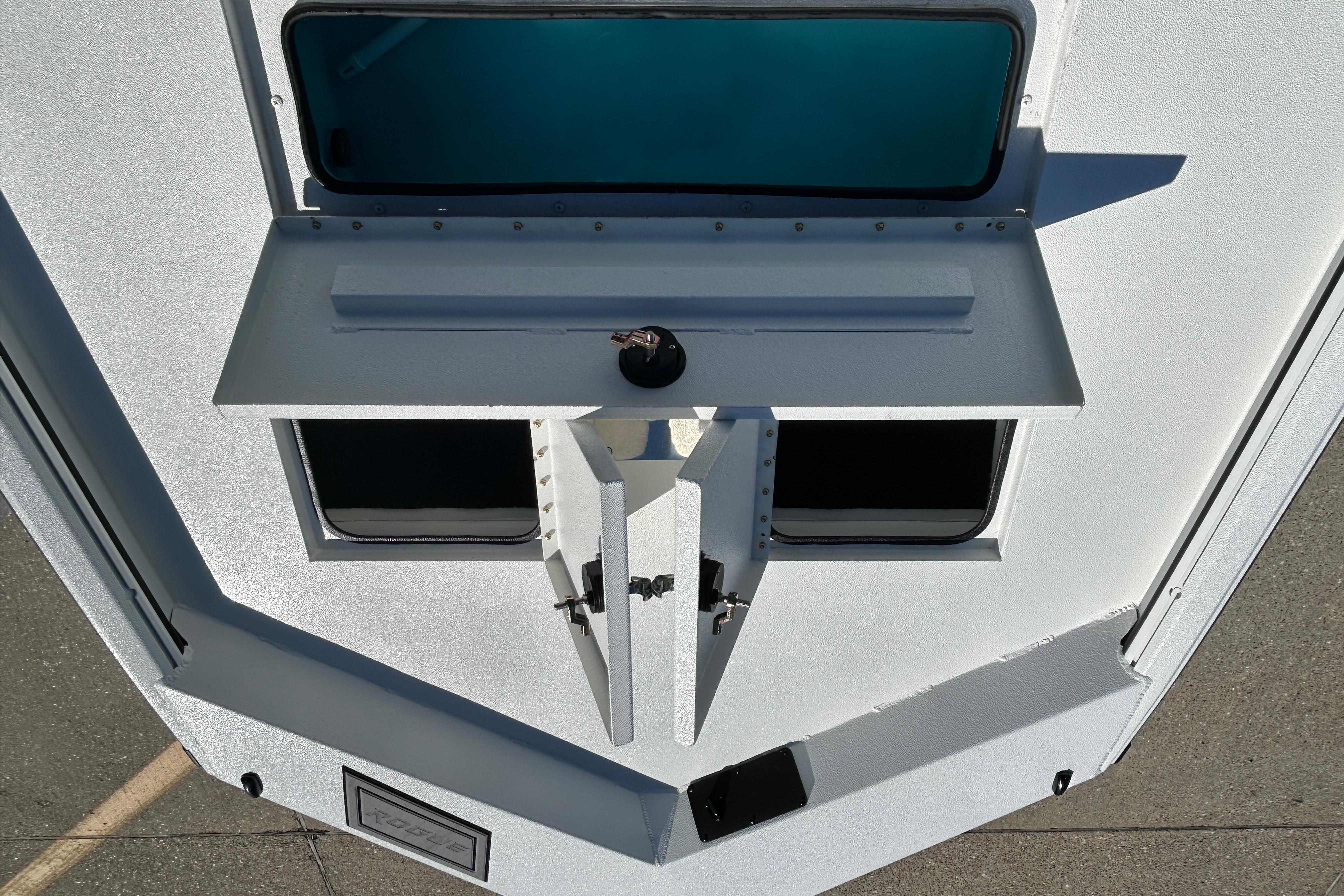 Avid 18 Rogue CC 2026 boat deck with open compartments and sleek design.