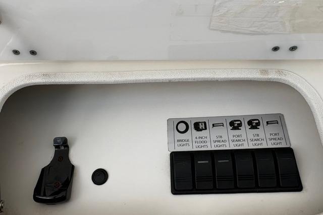 Control panel of a 2000 Silverton 42 Convertible boat with labeled switches.