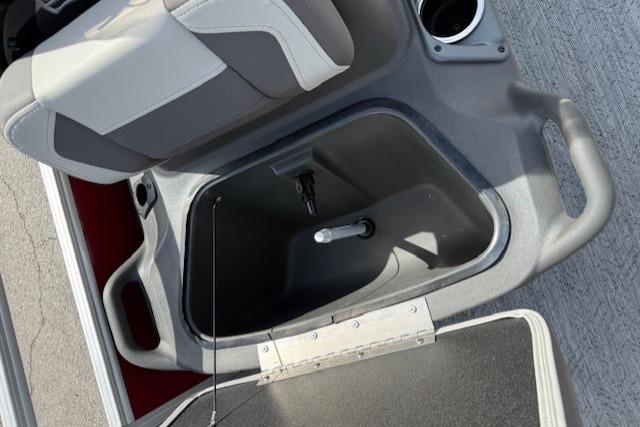 2026 Sun Tracker Bass Buggy 18 DLX boat seat with storage compartment open.
