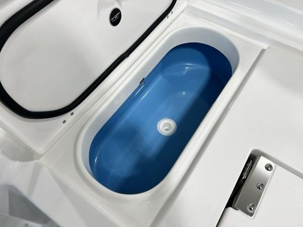 2025 Tidewater 2300 Carolina Bay boat livewell with blue interior.