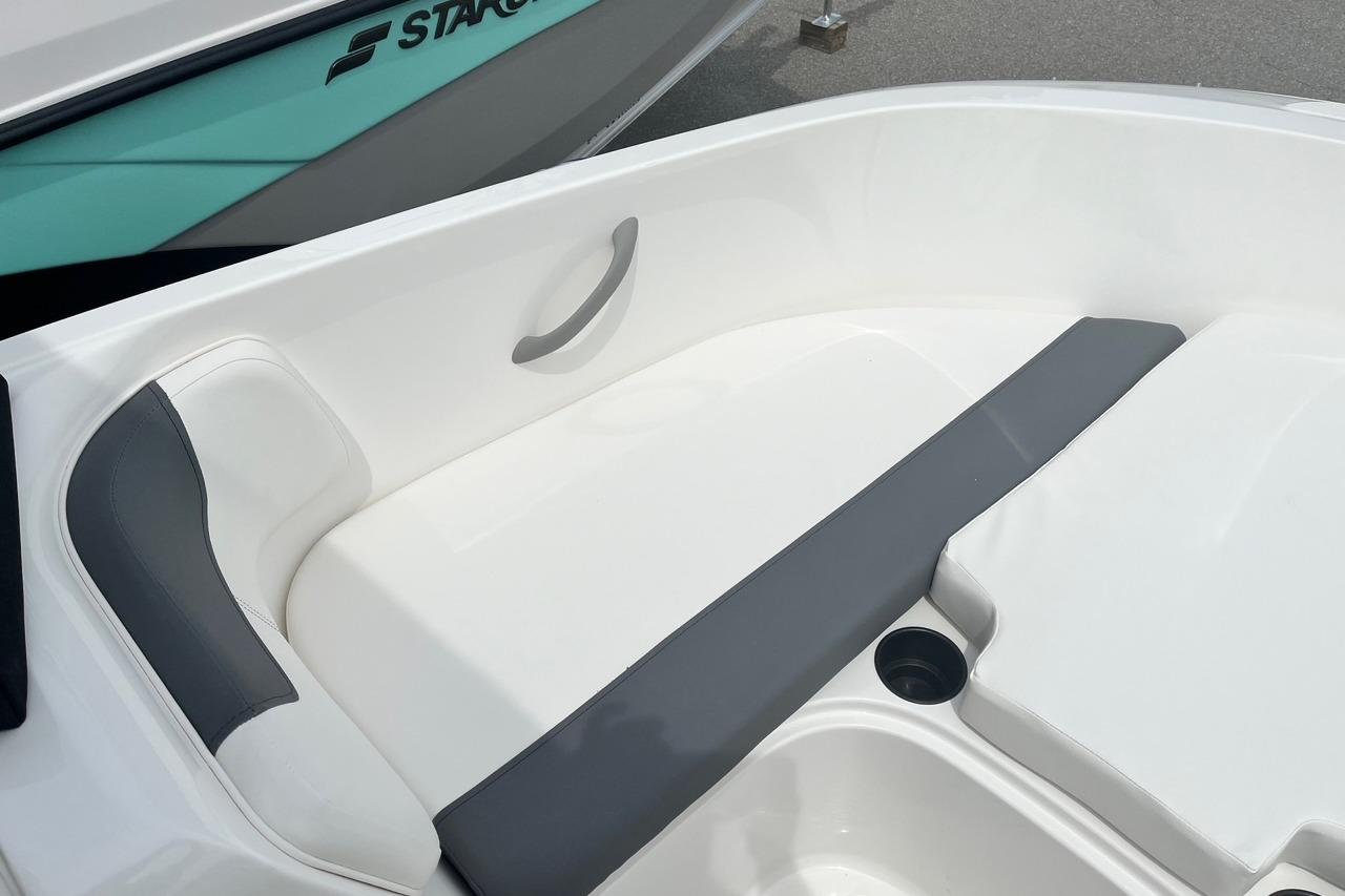 2026 Bayliner Element E16 boat interior with white and gray seating.